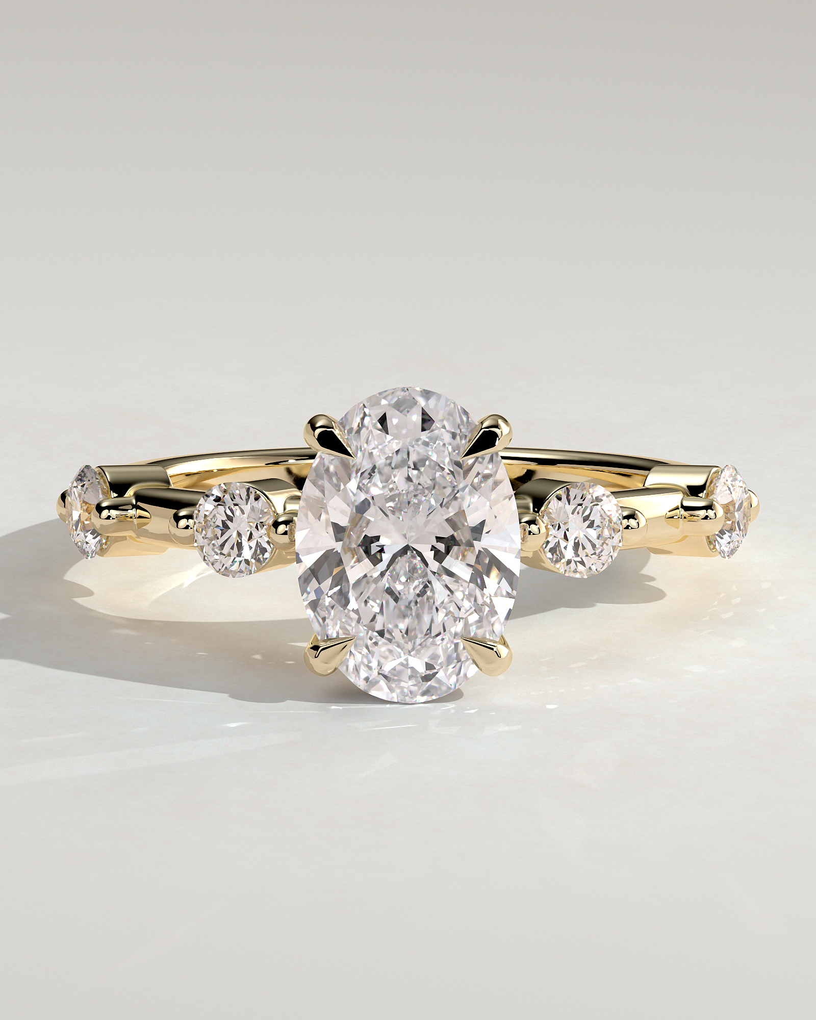 Arwen - Oval Solitaire with Hidden Halo and Accent Stones - 18k Yellow Gold