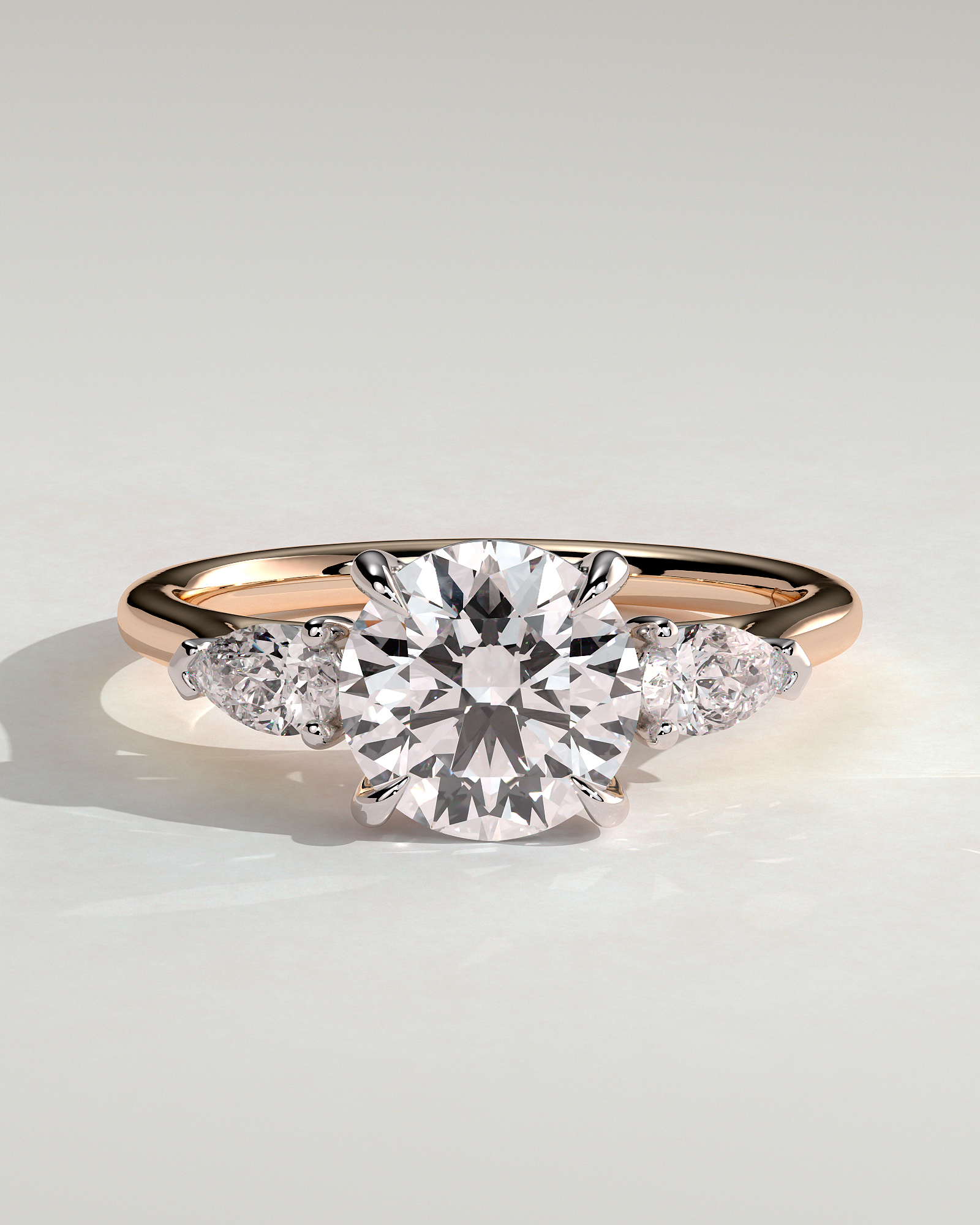 Arya - Round Trilogy with Pear Side Stones - 18k Rose Gold / 18k White Gold