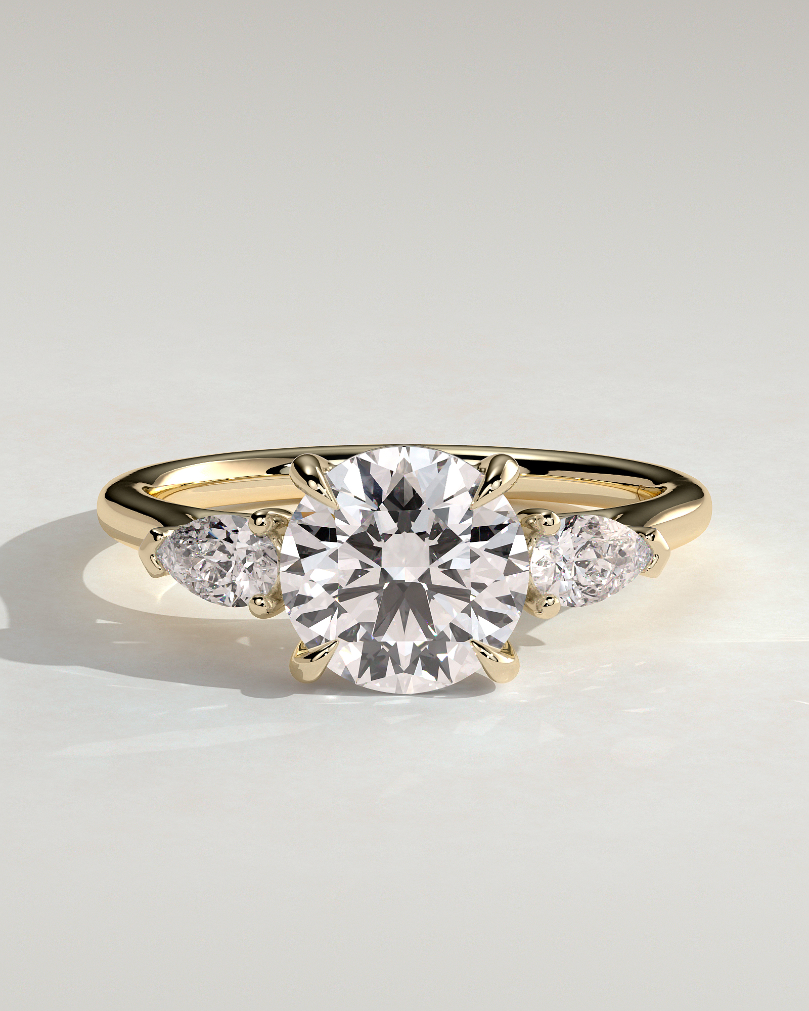 Arya - Round Trilogy with Pear Side Stones - 18k Yellow Gold