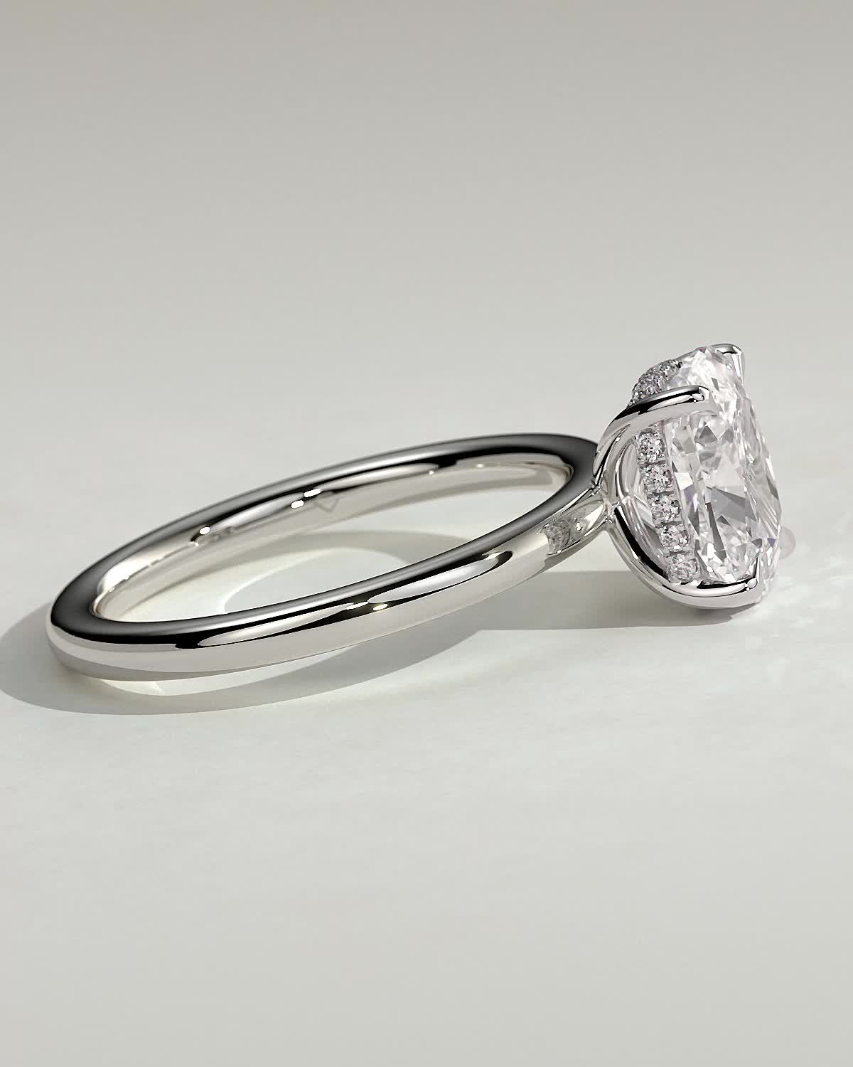 Ava - Elongated Cushion 4 Claw Solitaire with Hidden Halo Engagement Ring - 18k White Gold High Setting
