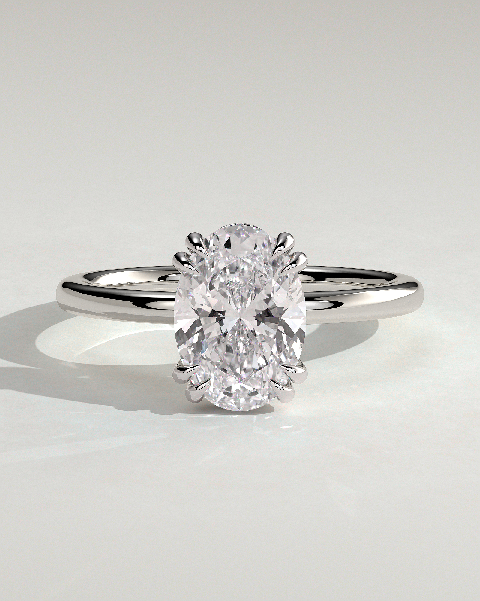 Avery - Oval 4 Double Claw Solitaire with Hidden Halo Engagement Ring - 18k White Gold High Setting