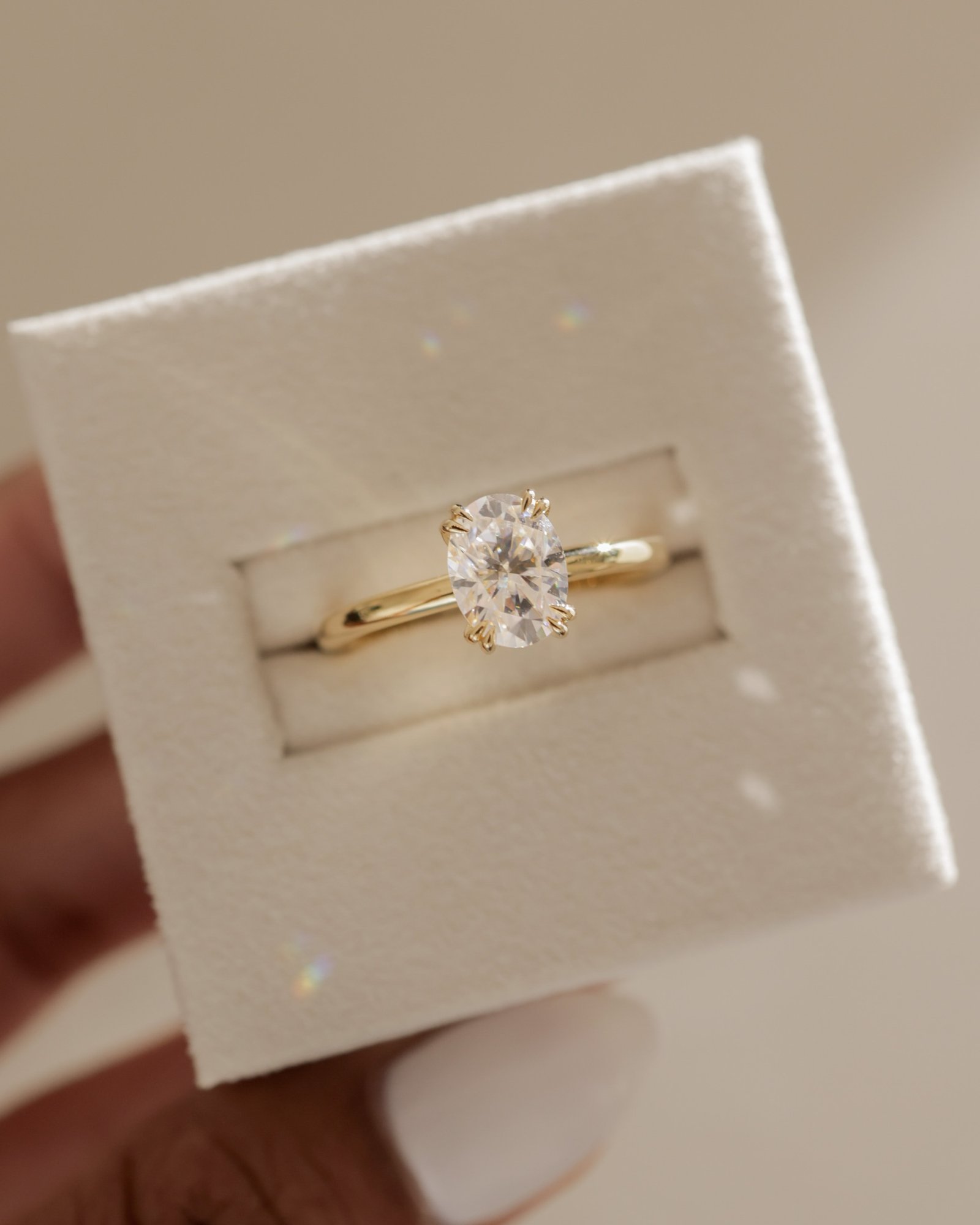 Avery  Double Tipped 4 Claw Oval Solitaire Lifestyle Image