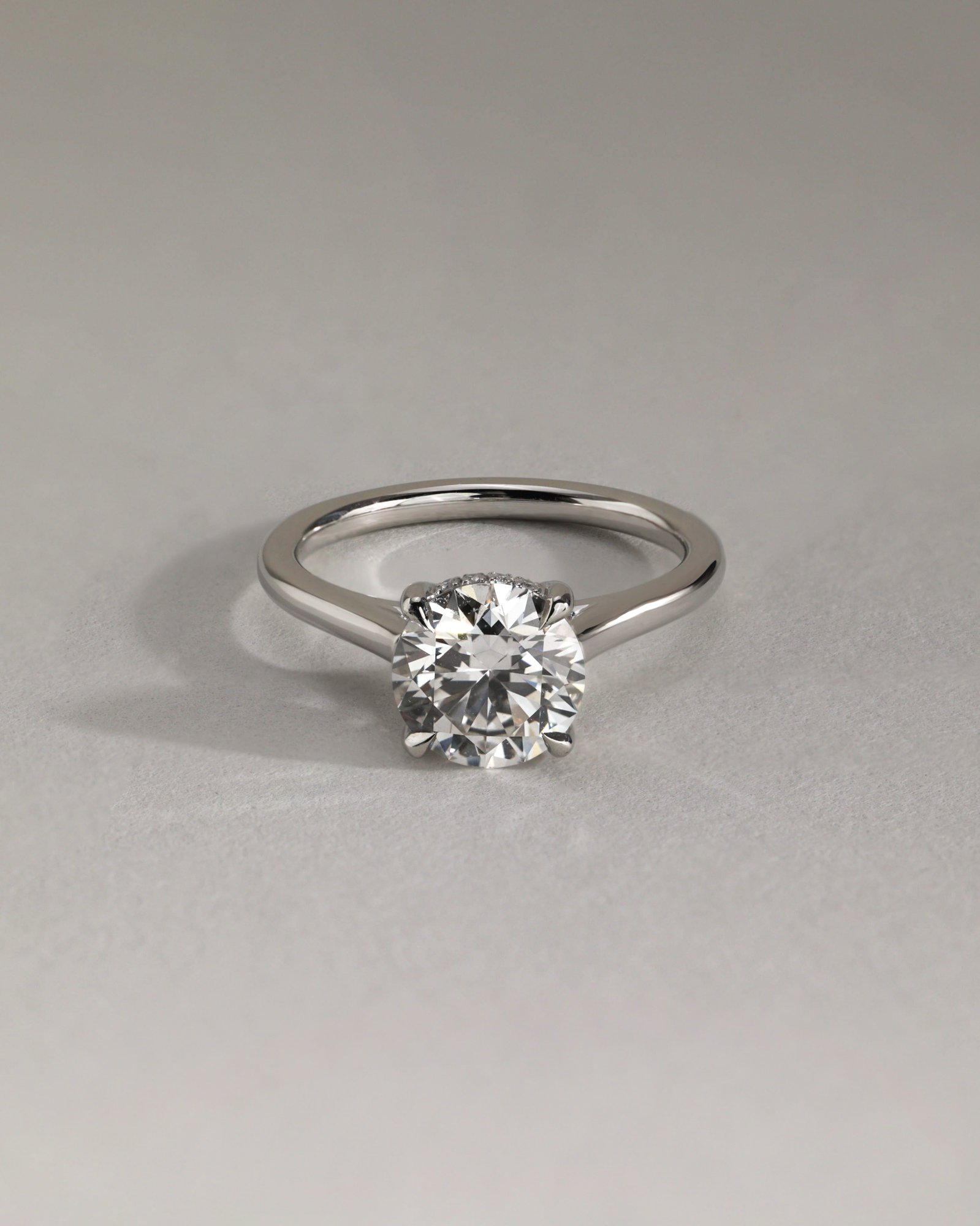 Bonnie  4 Claw Round Solitaire with Hidden Halo Lifestyle Image