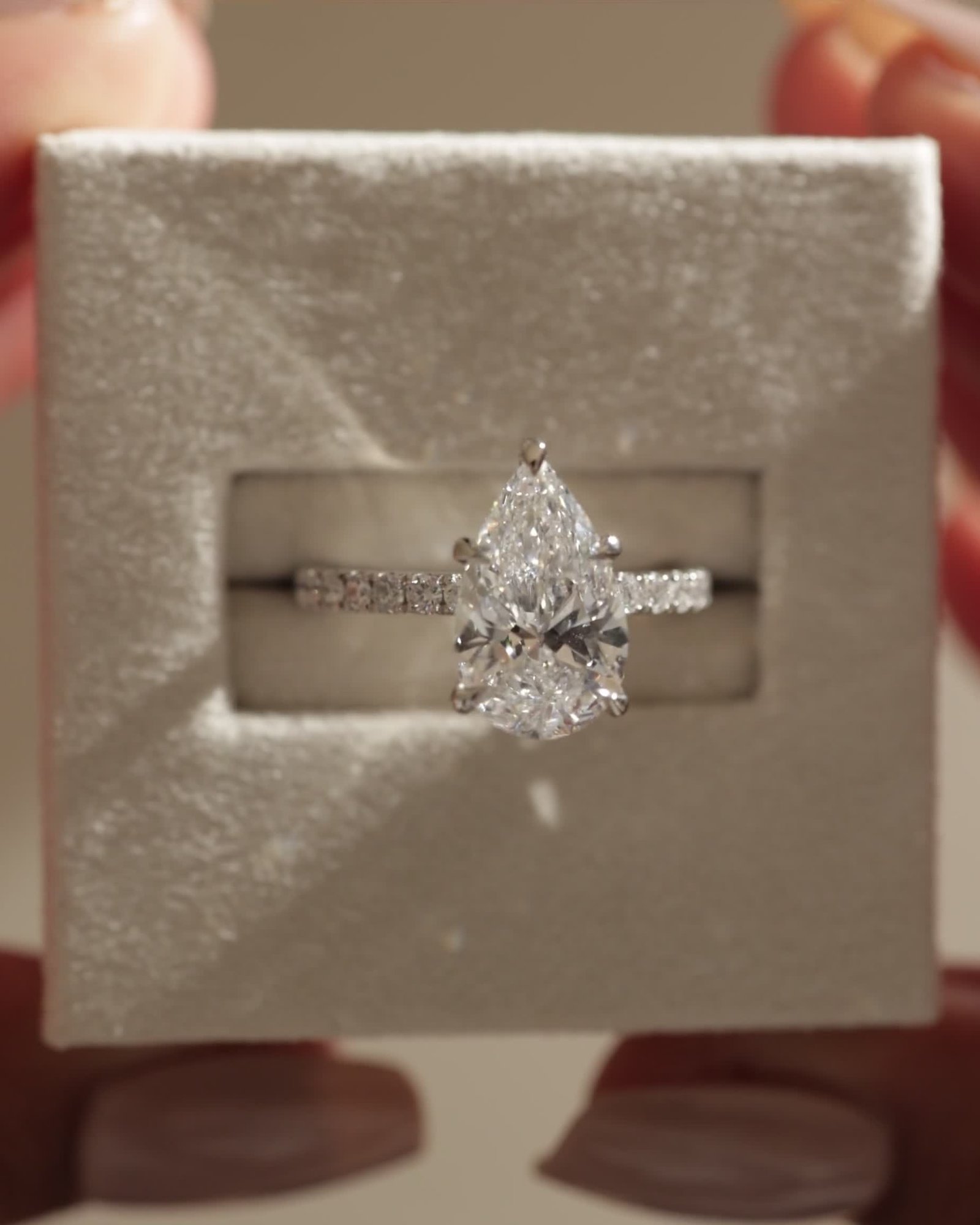 Brynlee - 5 Claw Pear Solitaire with 2/3 Pave Band Lifestyle Image