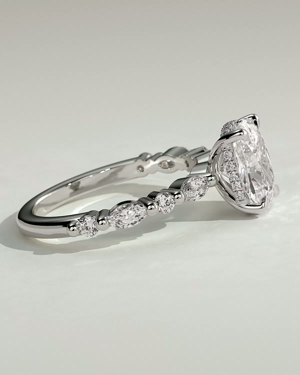 Cali - 4 Claw Elongated Cushion Solitaire with Accent Stones - 18k White Gold
