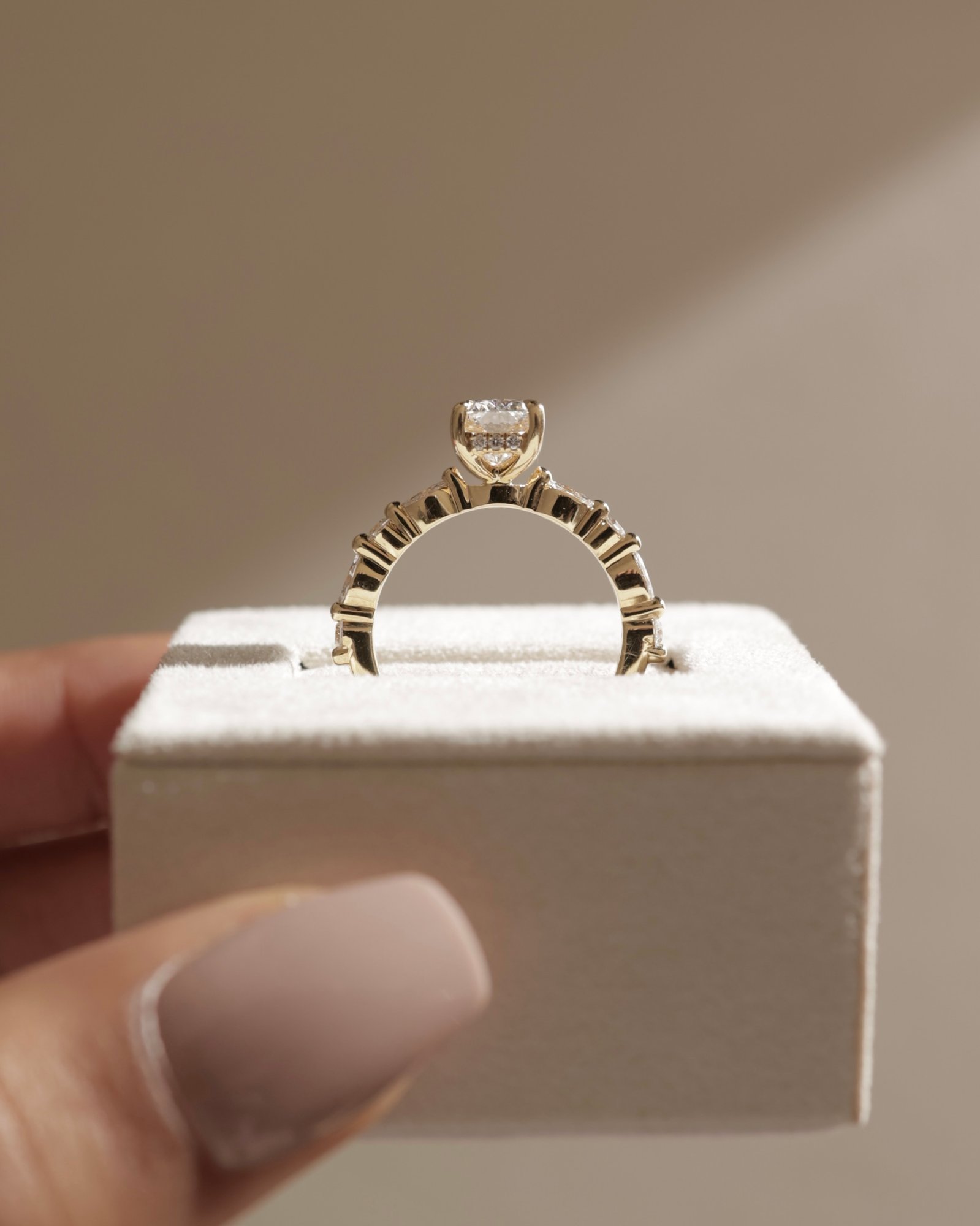 Cali - 4 Claw Elongated Cushion Solitaire with Accent Stones Lifestyle Image