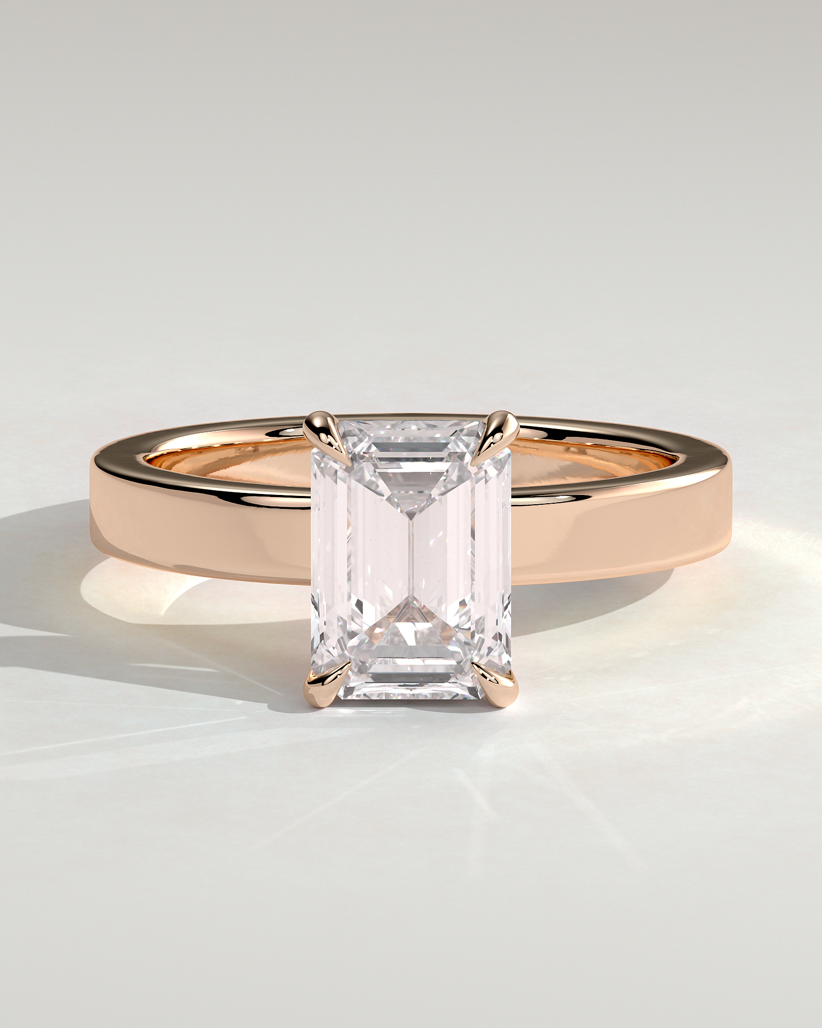 Carmella - Emerald 4 Claw Solitaire with Flat Cigar Band and Hidden Halo Engagement Ring - 18k Rose Gold High Setting