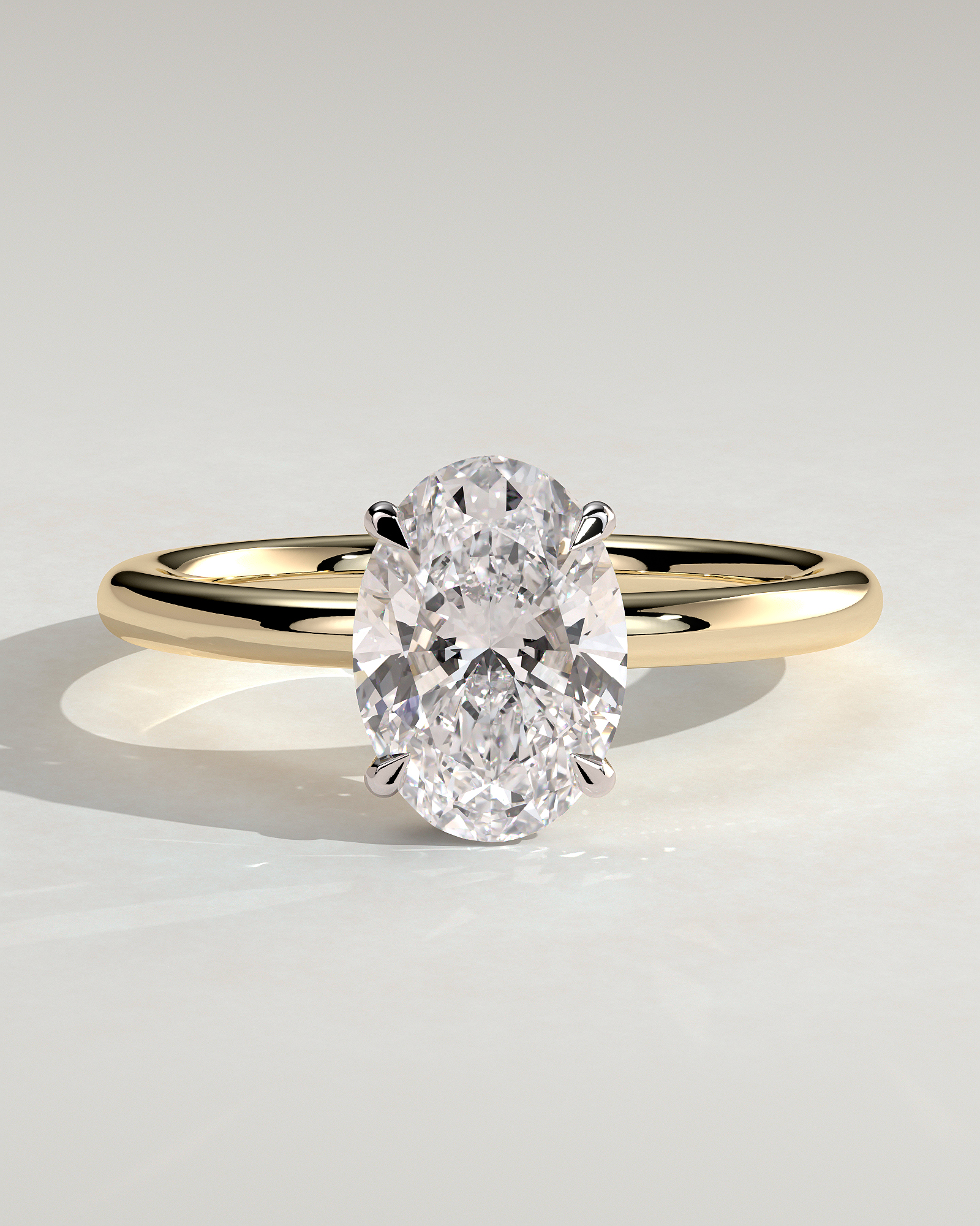 Cecilia - Oval Solitaire with Wrap Around Hidden Halo - 18k Yellow Gold / 18k White Gold