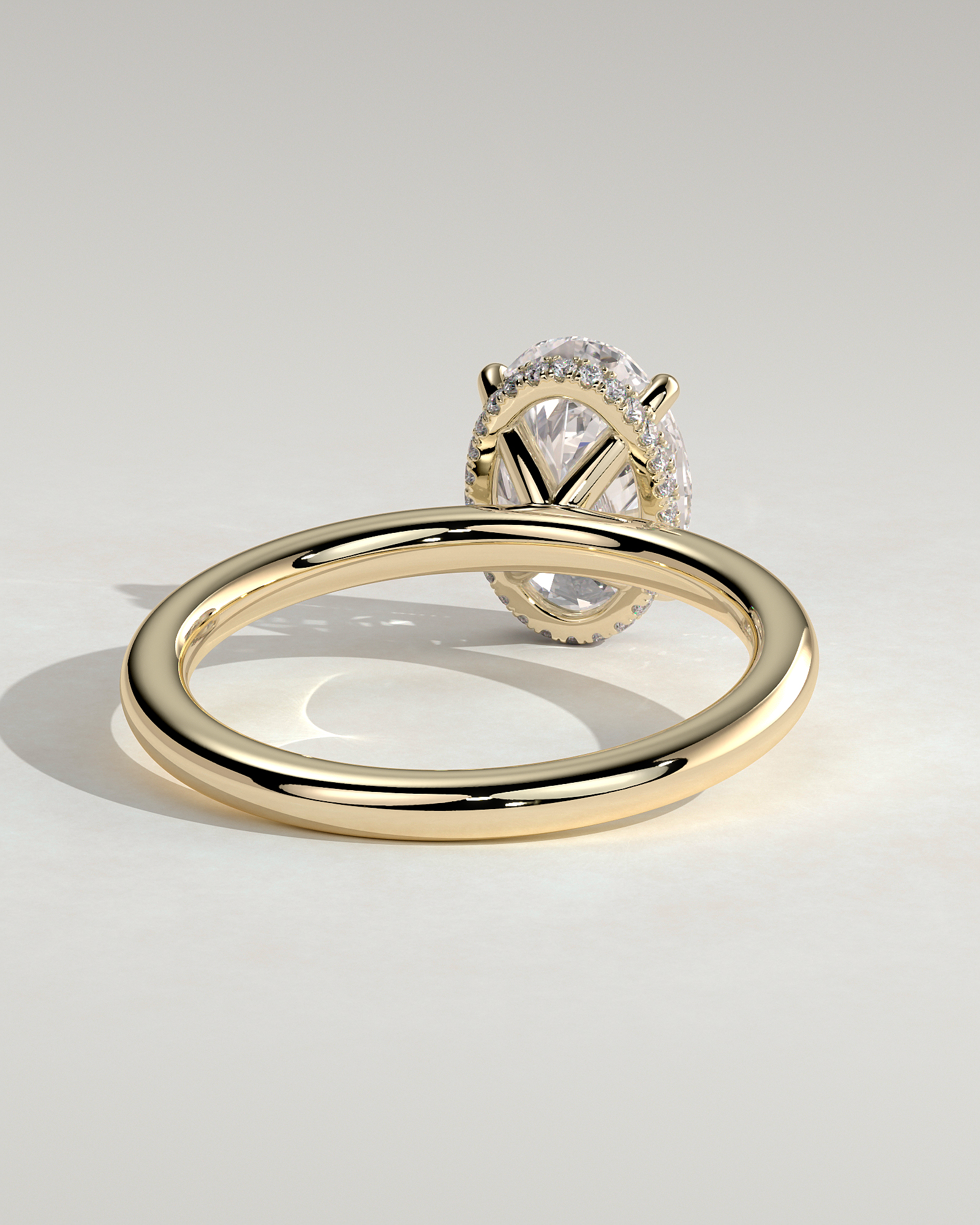 Cecilia - Oval Solitaire with Wrap Around Hidden Halo - 18k Yellow Gold