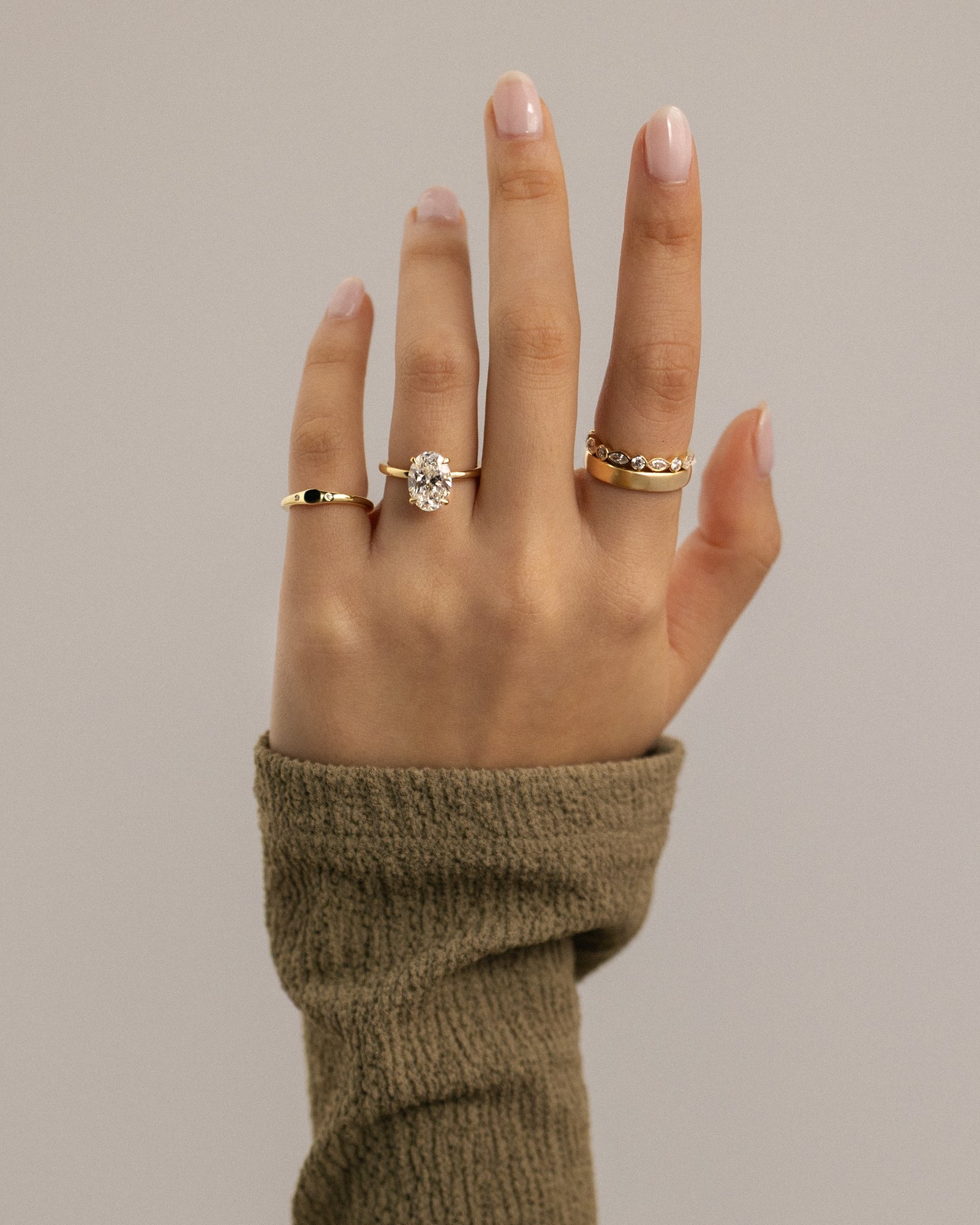 Cecilia - Oval Solitaire with Wrap Around Hidden Halo Lifestyle Image