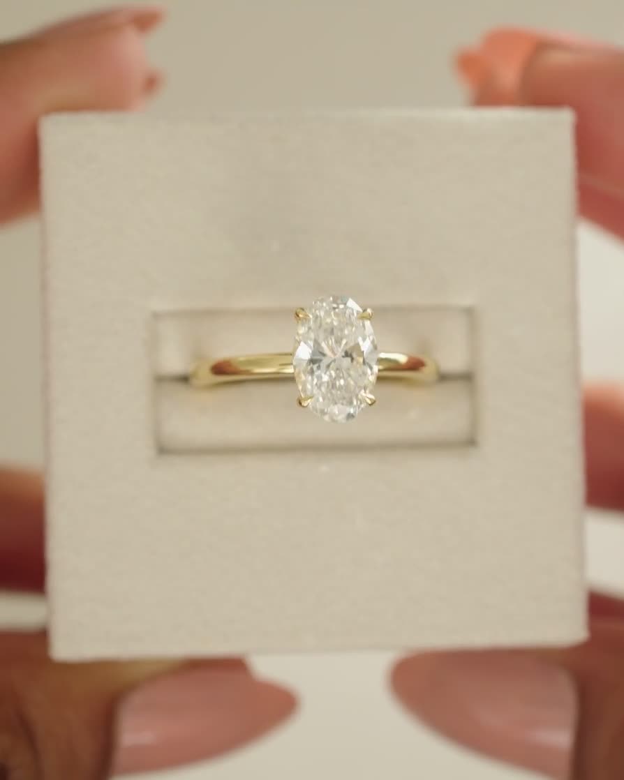 Cecilia - Oval Solitaire with Wrap Around Hidden Halo Lifestyle Image