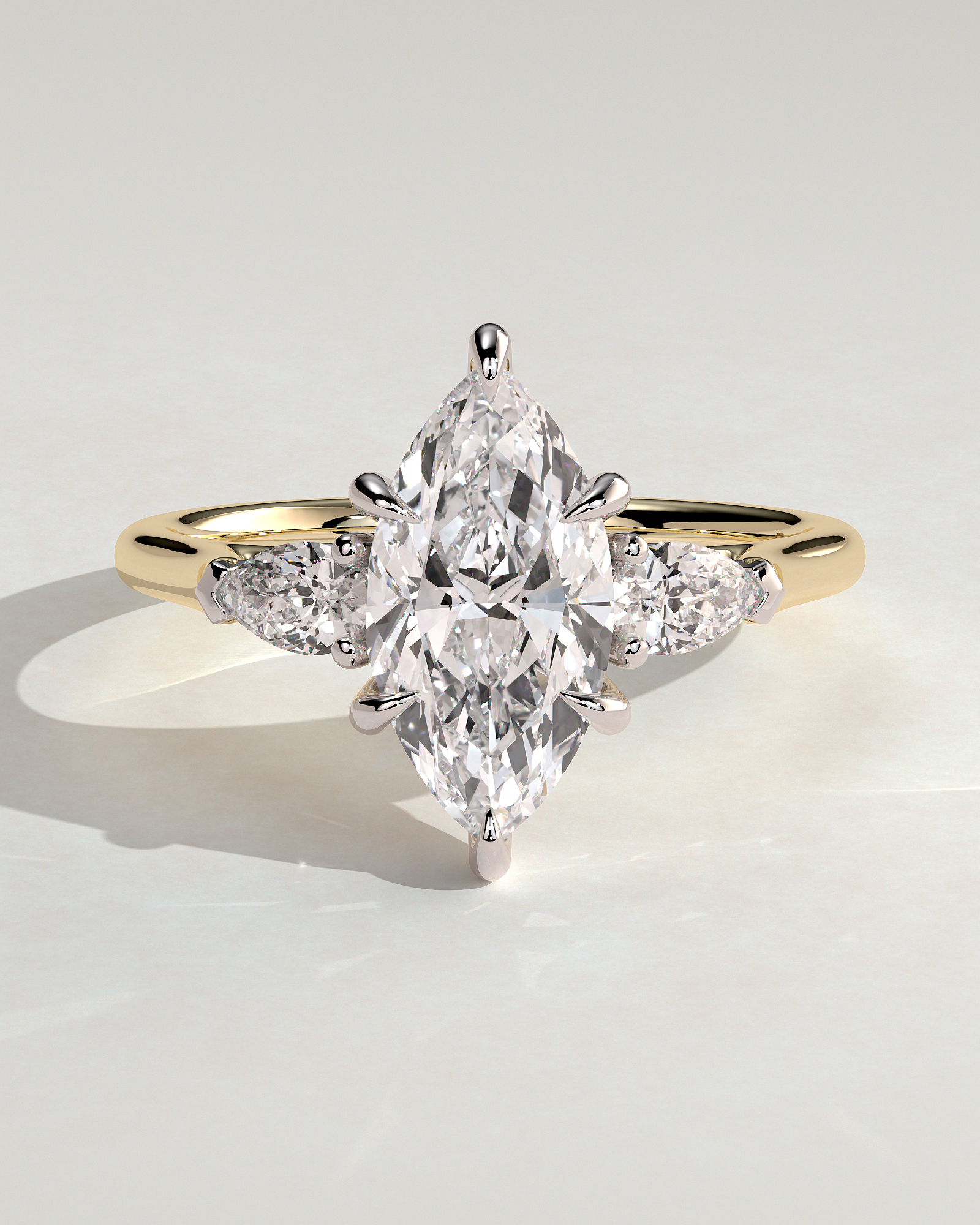 Marquise 6 Claw Trilogy with Pear Side Stones Engagement Ring - 18k Yellow Gold / 18k White Gold