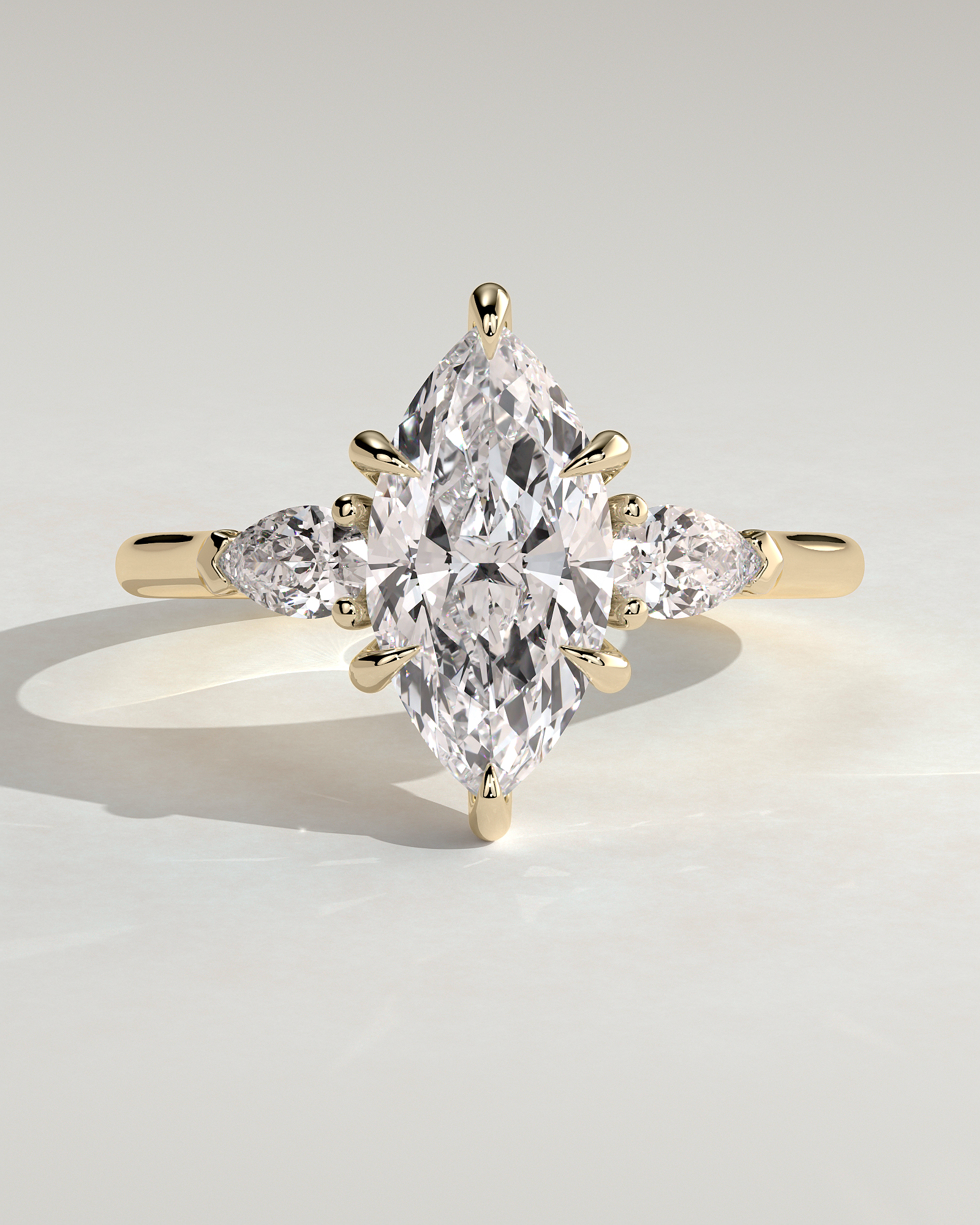 Marquise 6 Claw Trilogy with Pear Side Stones Engagement Ring - 18k Yellow Gold