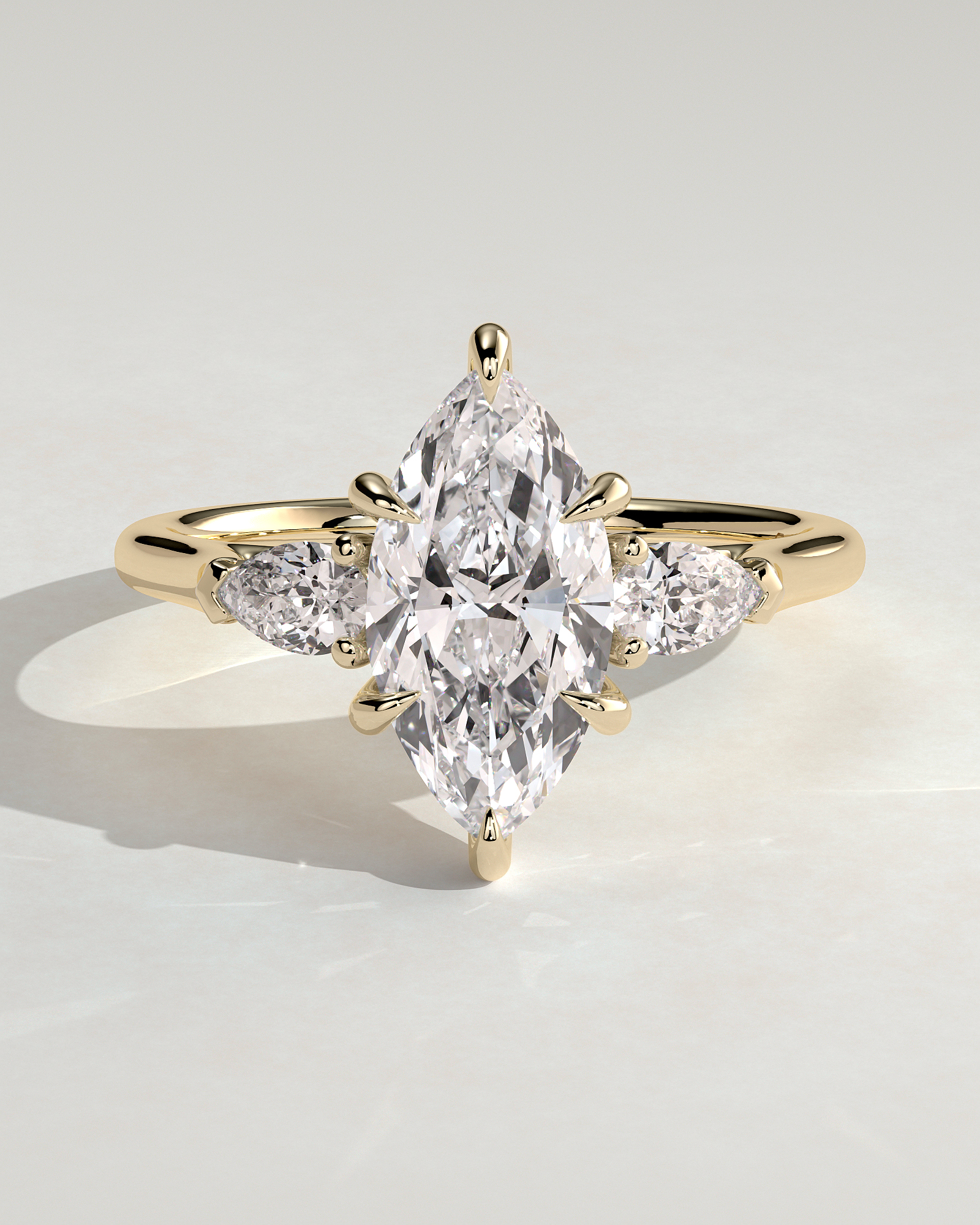 Marquise 6 Claw Trilogy with Pear Side Stones Engagement Ring - 18k Yellow Gold