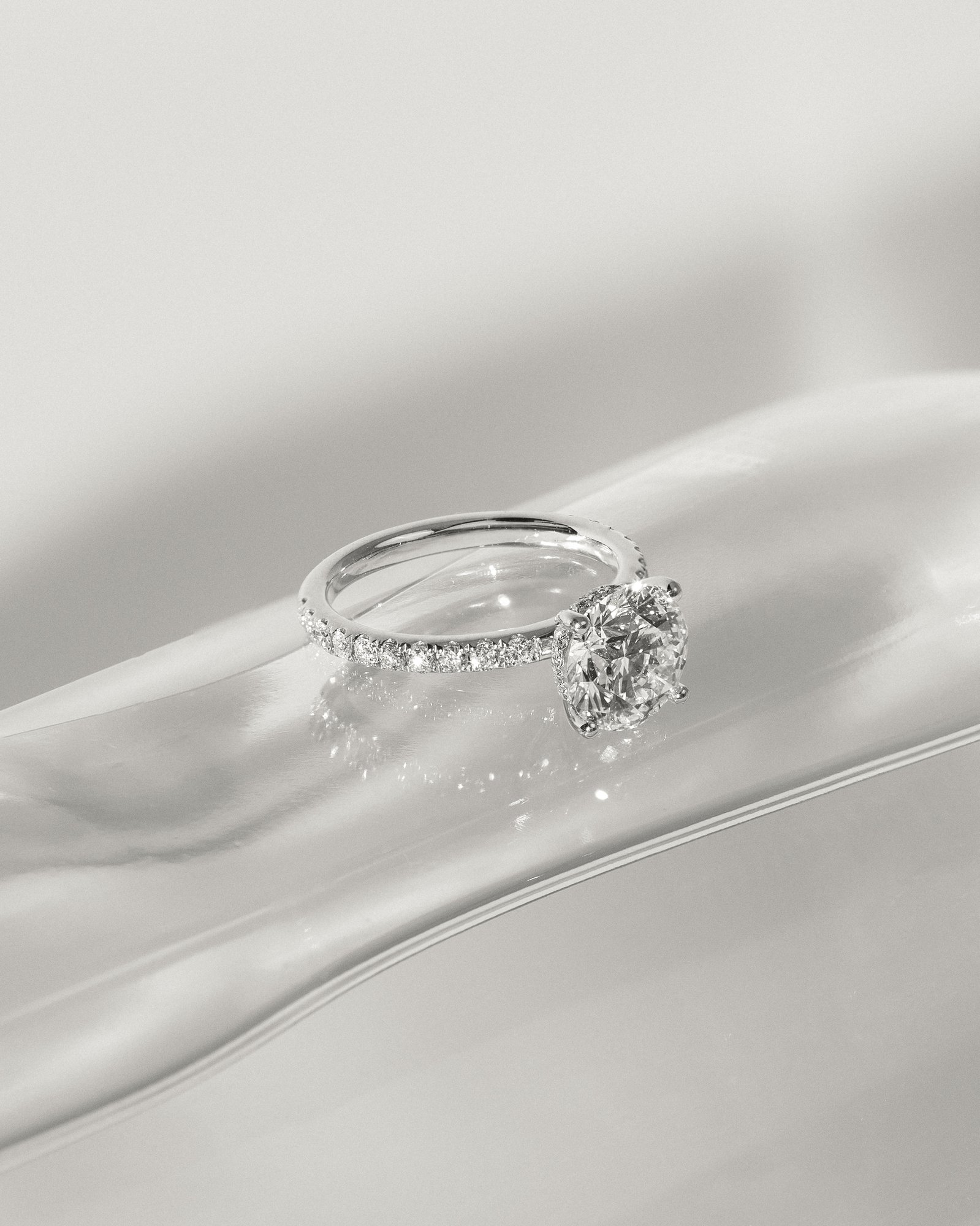 Charlie - 4 Claw Pav Round Solitaire with Hidden Halo Lifestyle Image