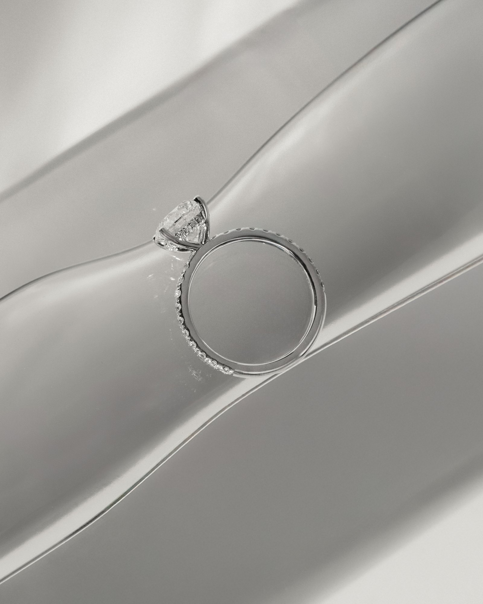 Charlie - 4 Claw Pav Round Solitaire with Hidden Halo Lifestyle Image