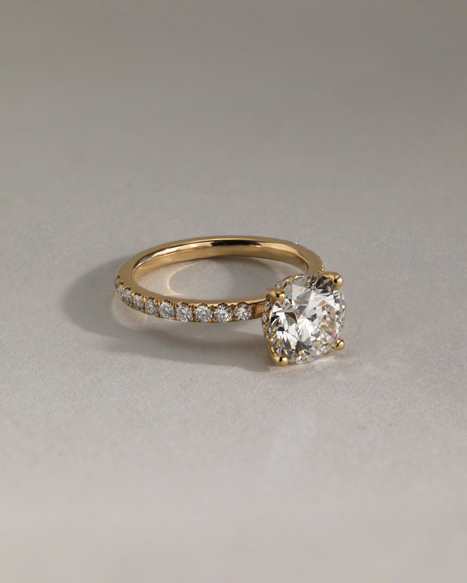 Charlie - 4 Claw Pav Round Solitaire with Hidden Halo Lifestyle Image