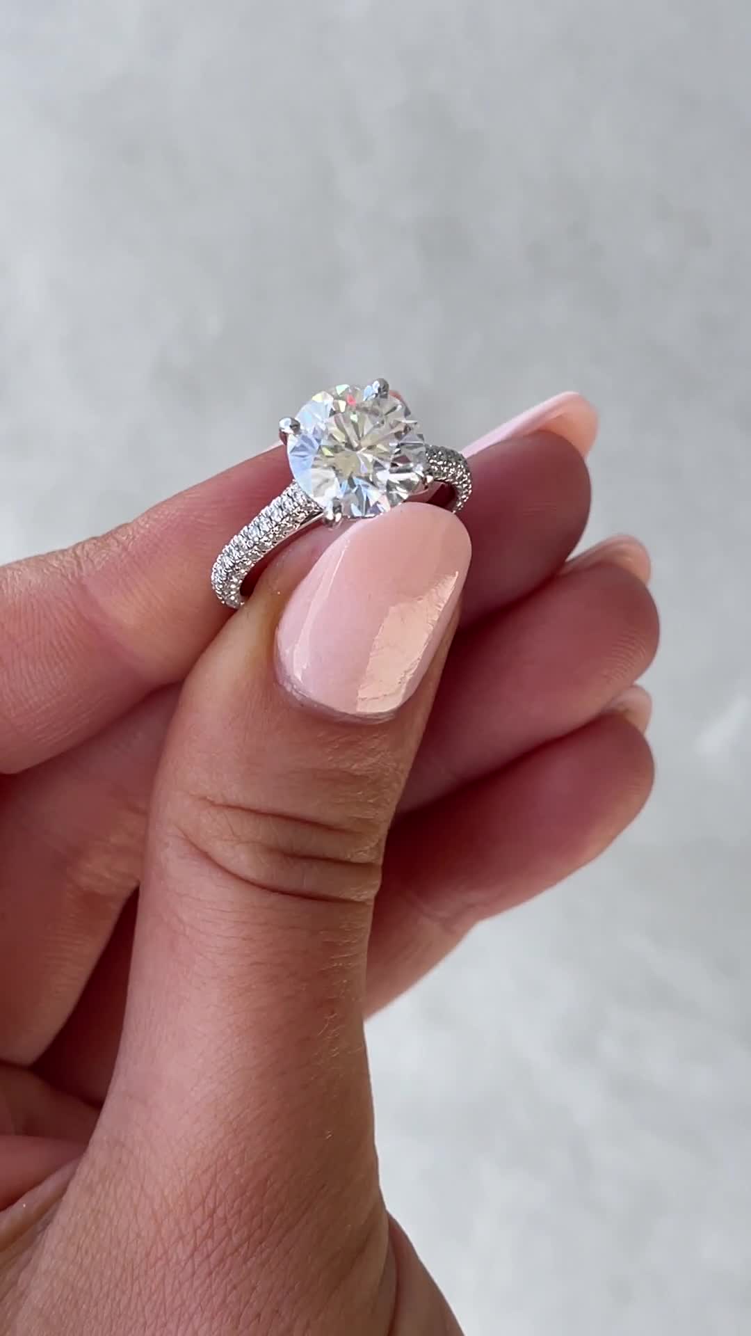 Chelsea  4 Claw Triple Pav Cathedral Round Solitaire Lifestyle Image