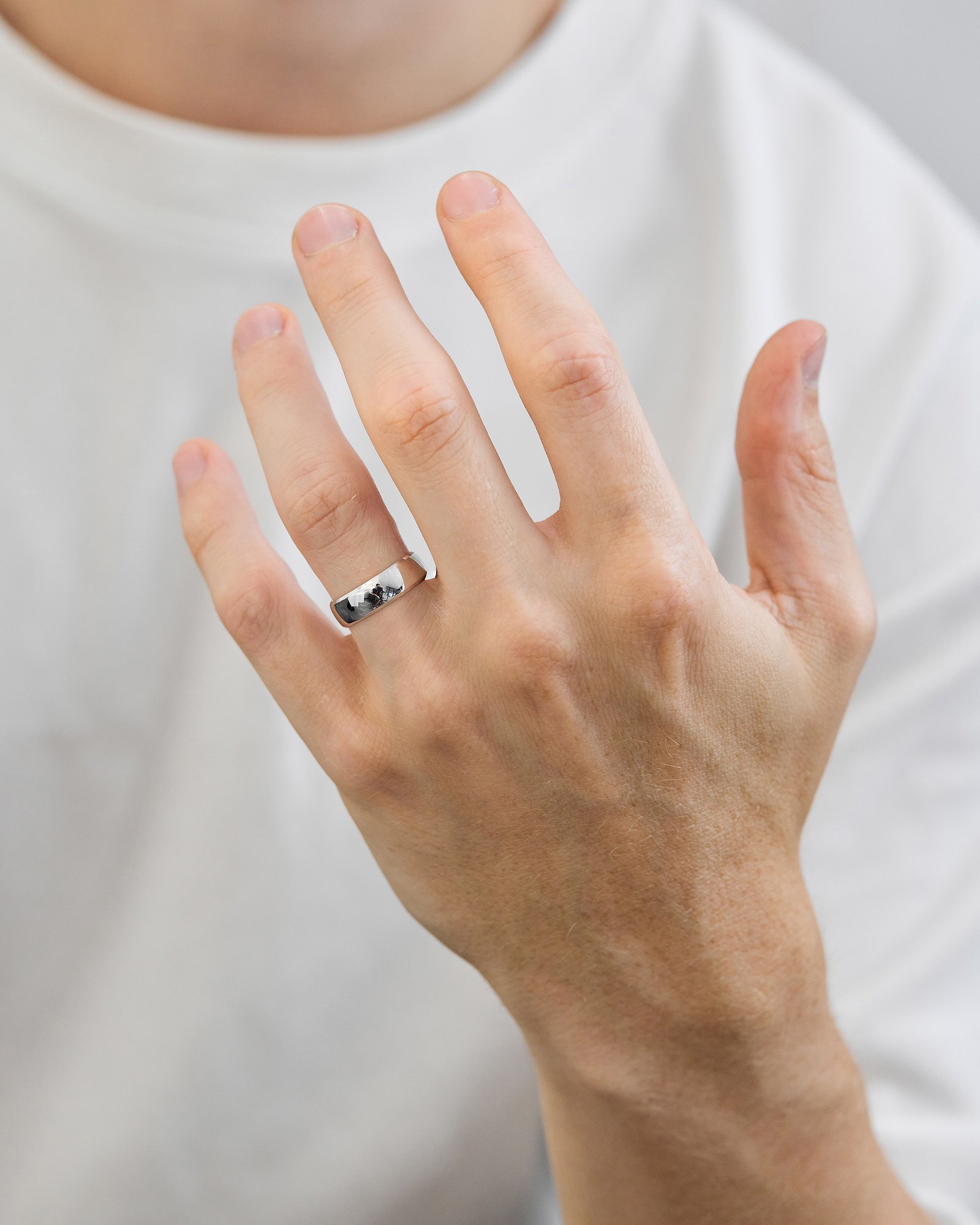 Classic Round Bevel Mens Wedding Ring Lifestyle Image