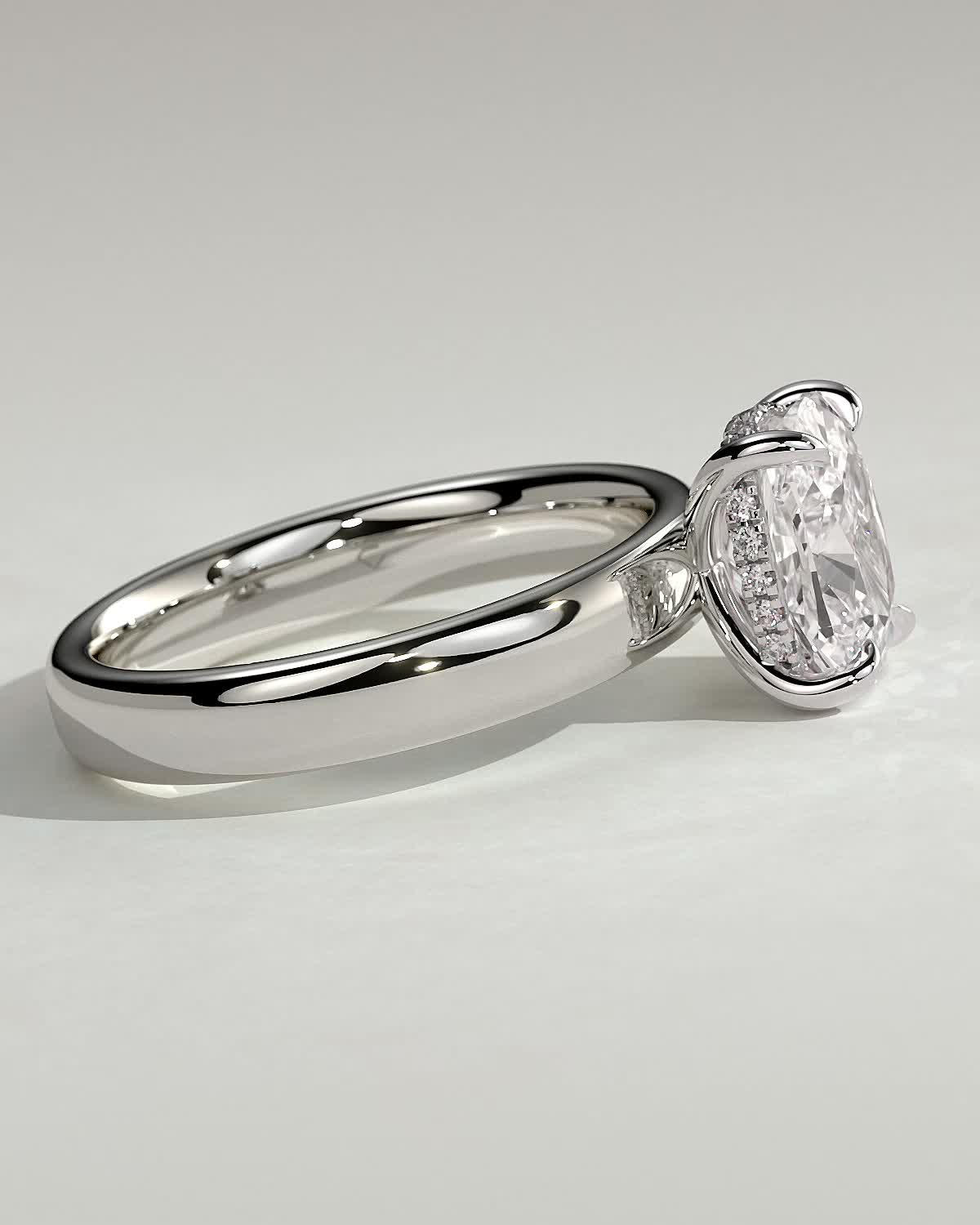 Cora - Elongated Cushion 4 Claw Solitaire with Cigar Band and Hidden Halo Engagement Ring - 18k White Gold High Setting