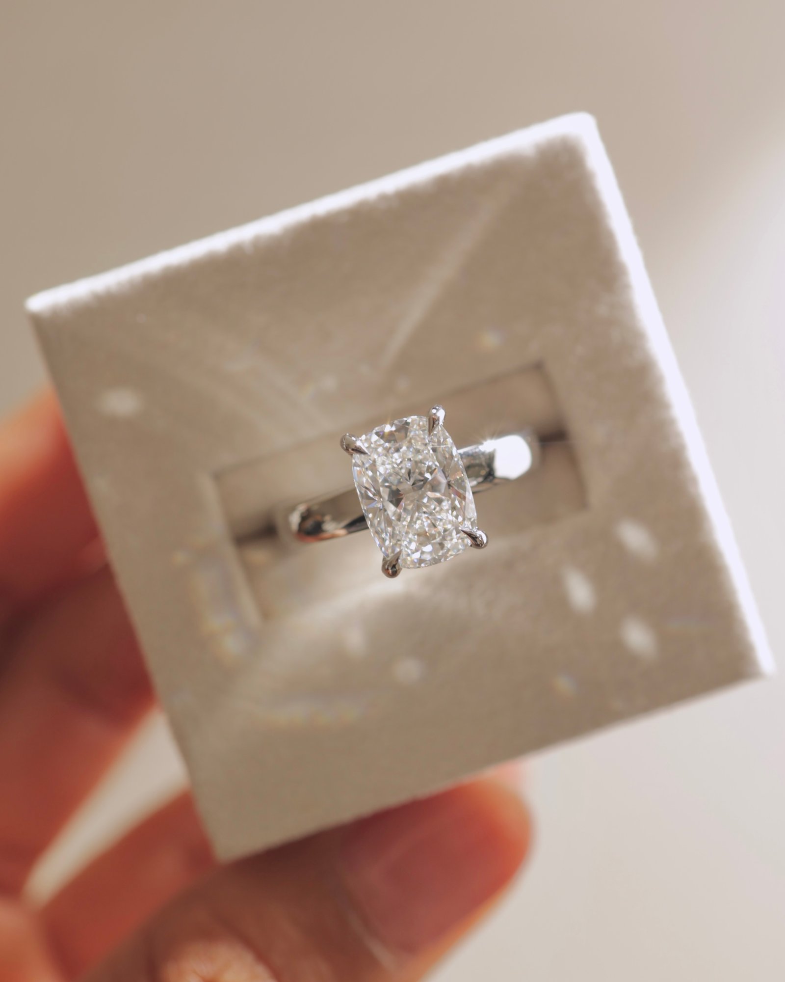 Cora - Elongated Cushion Solitaire with Cigar Band and Hidden Halo Lifestyle Image