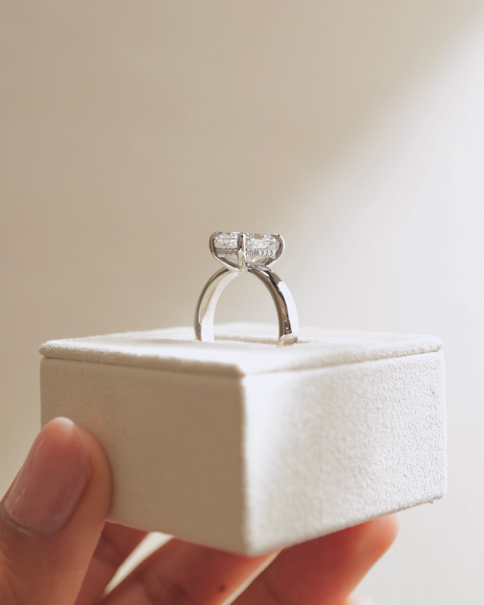 Cora - Elongated Cushion Solitaire with Cigar Band and Hidden Halo Lifestyle Image