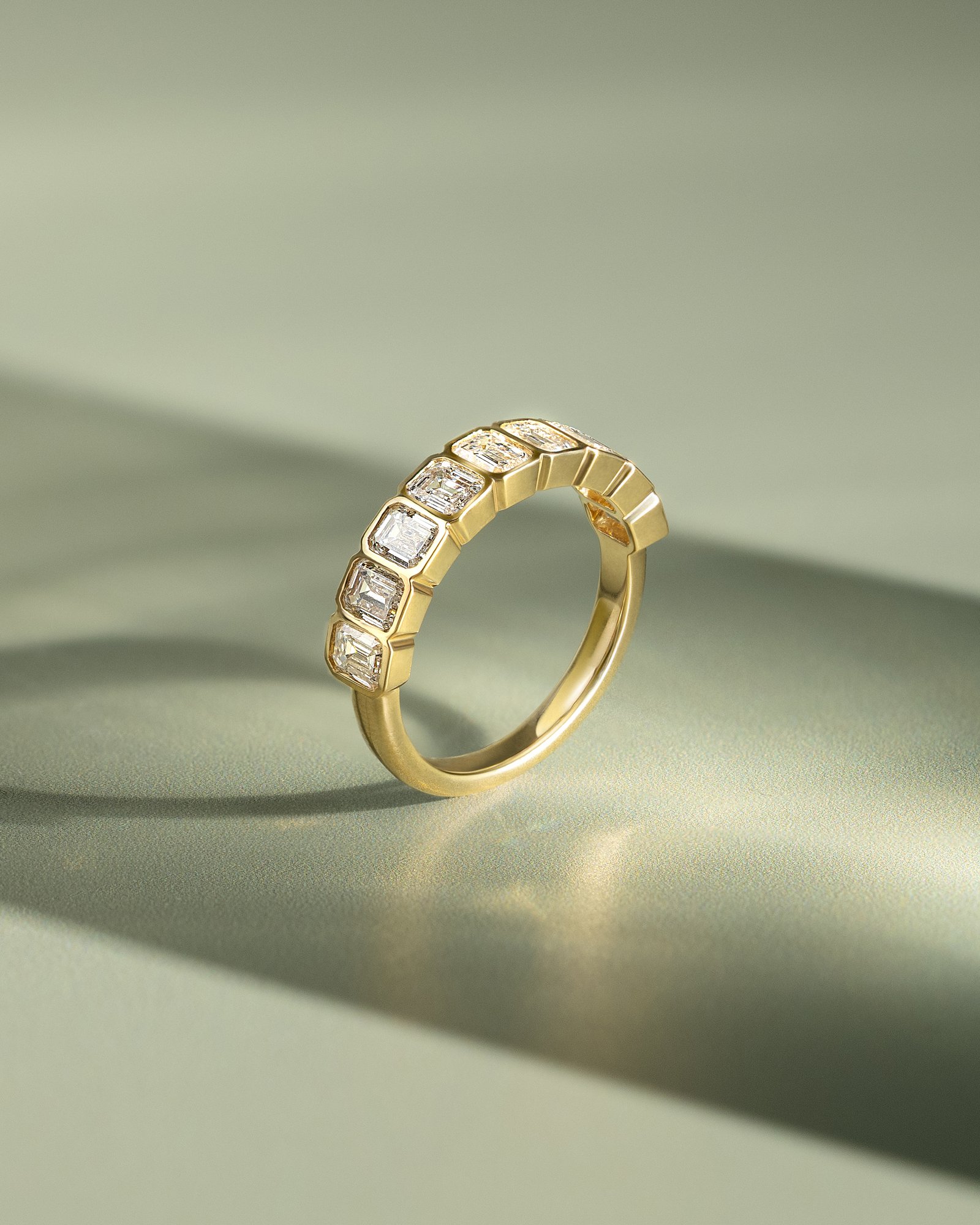 Dallas - Bezel Set Emerald Wedding Ring Lifestyle Image