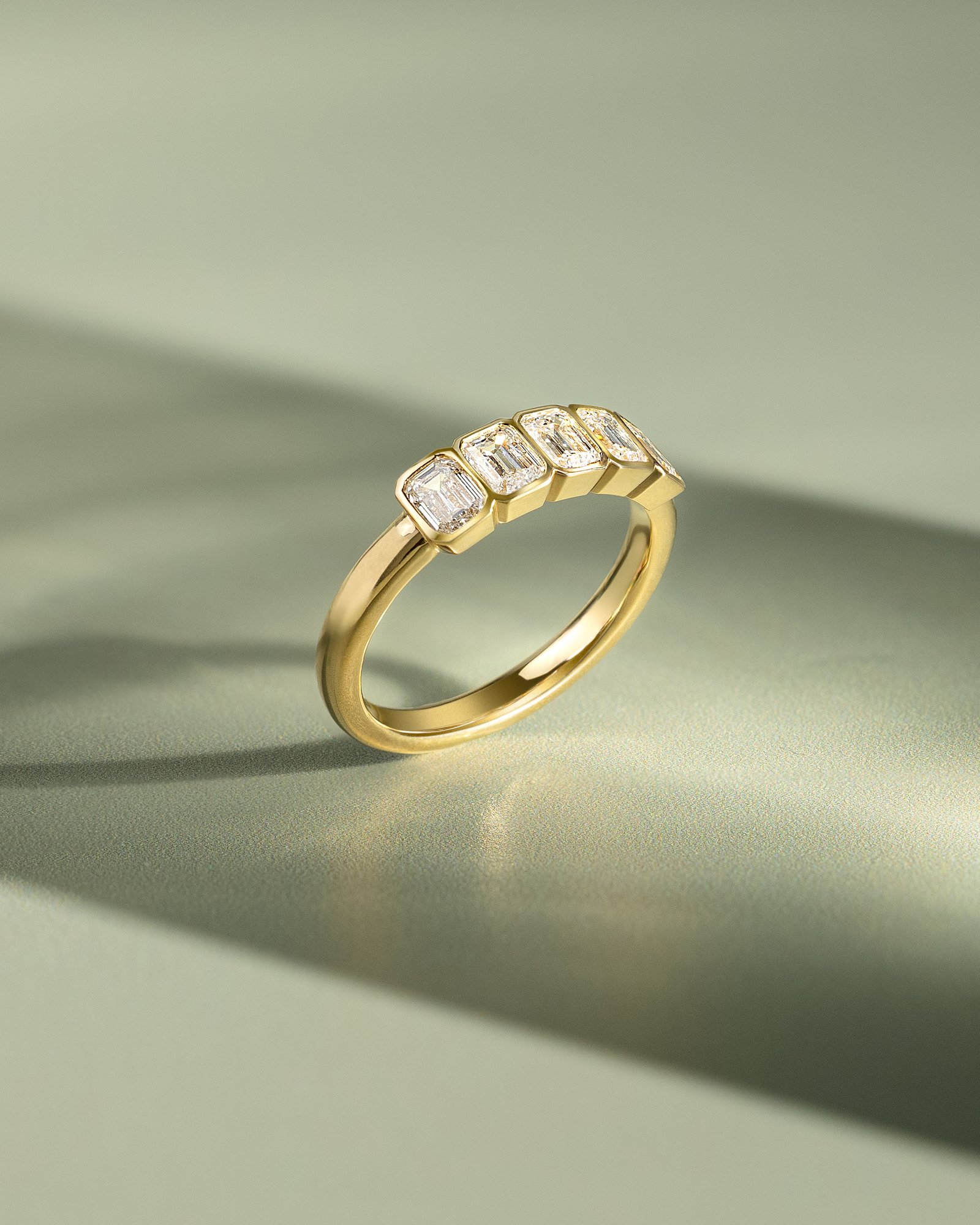 Dallas - Bezel Set Emerald Wedding Ring Lifestyle Image