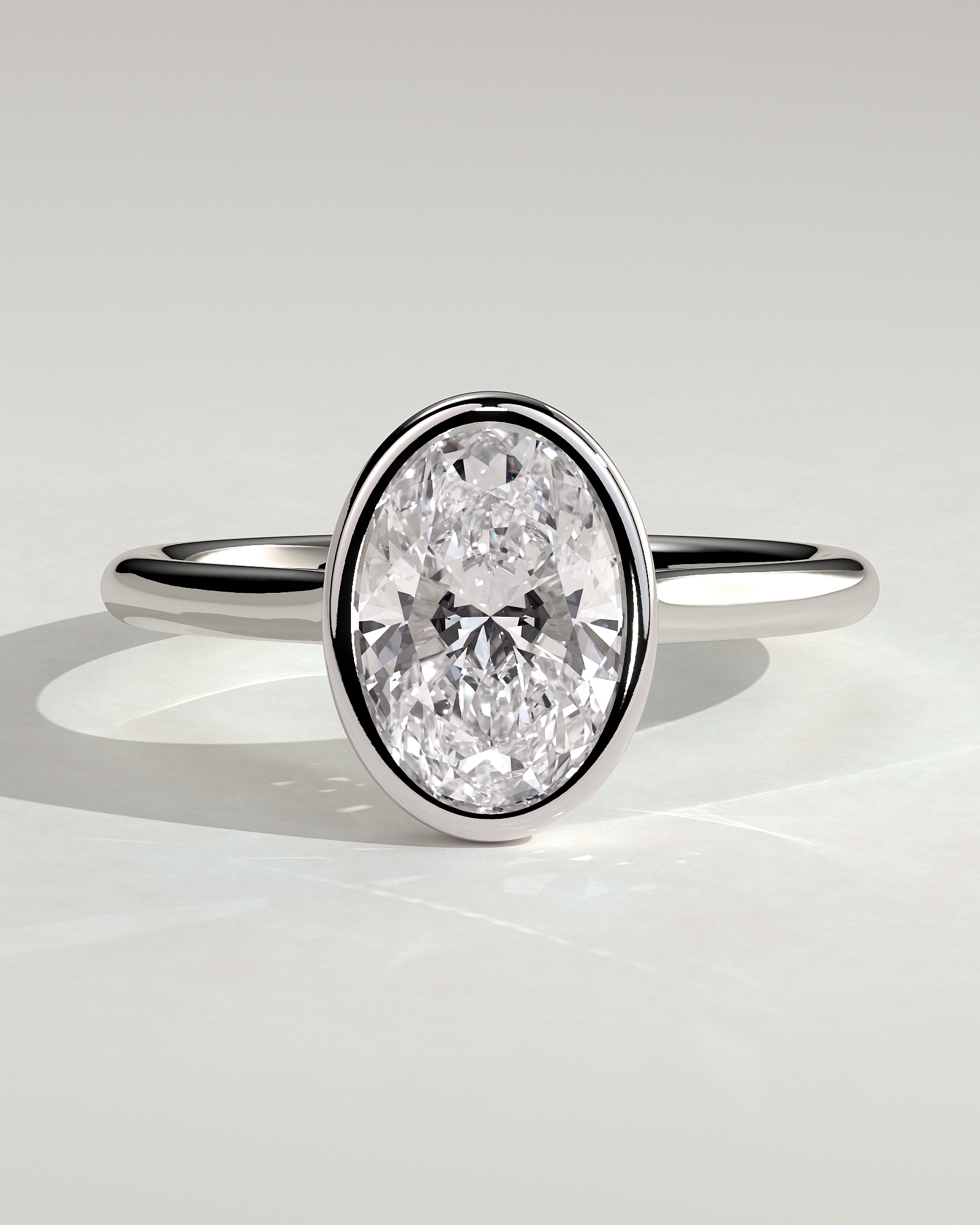 Daphne - Oval Solitaire with Cathedral Bezel Setting - 18k White Gold