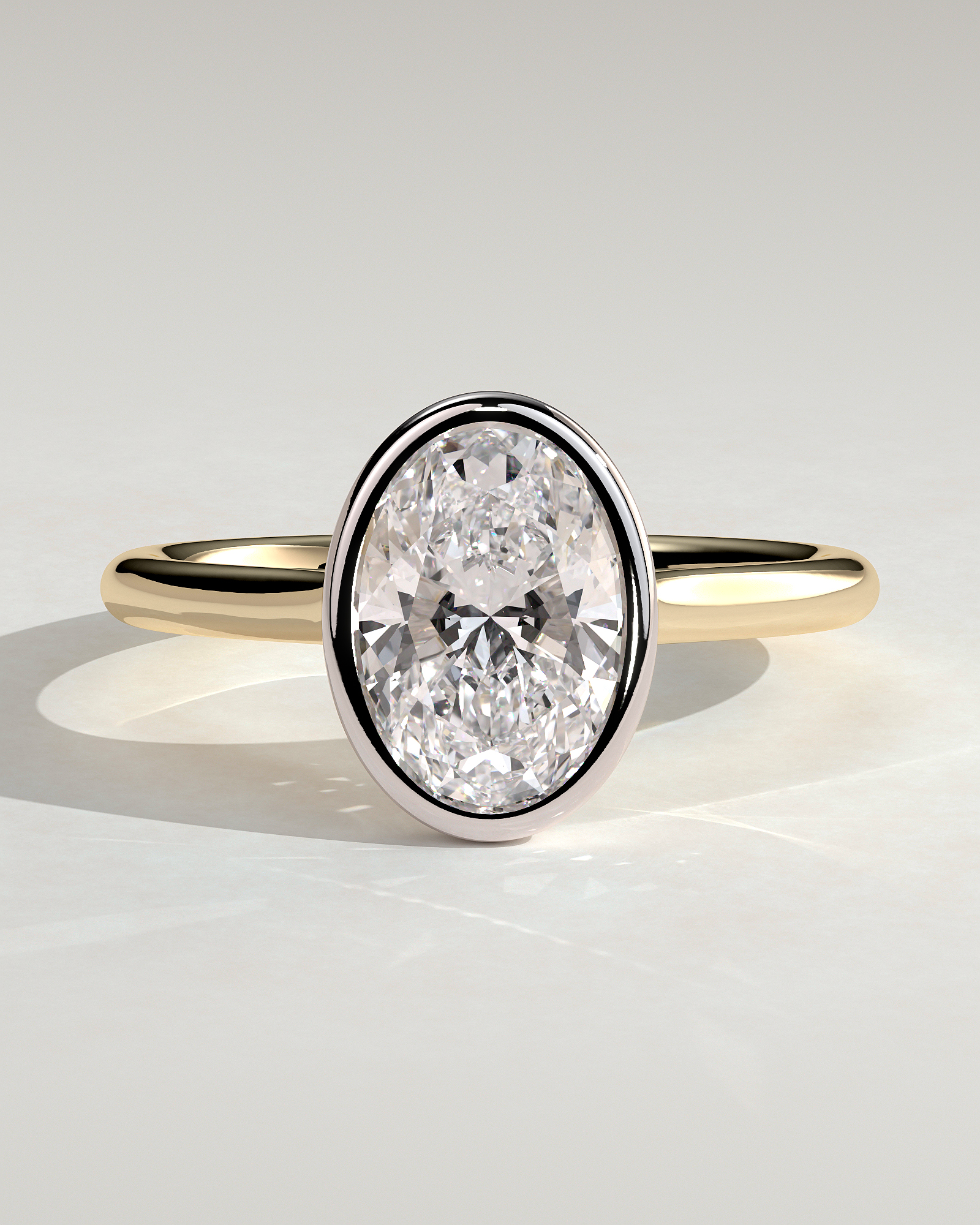 Daphne - Oval Solitaire with Cathedral Bezel Setting - 18k Yellow Gold / 18k White Gold