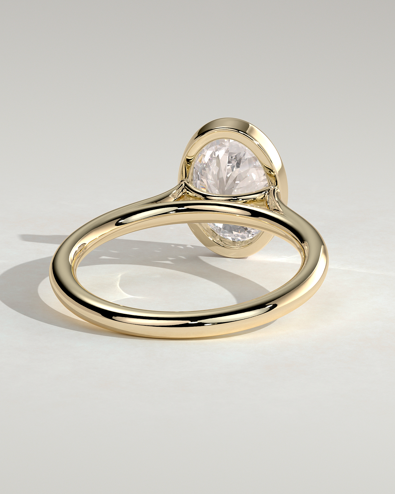 Daphne - Oval Solitaire with Cathedral Bezel Setting - 18k Yellow Gold