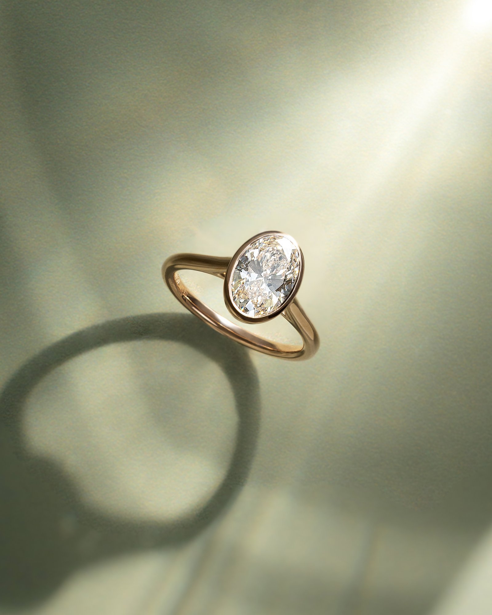 Daphne - Oval Solitaire with Cathedral Bezel Setting Lifestyle Image