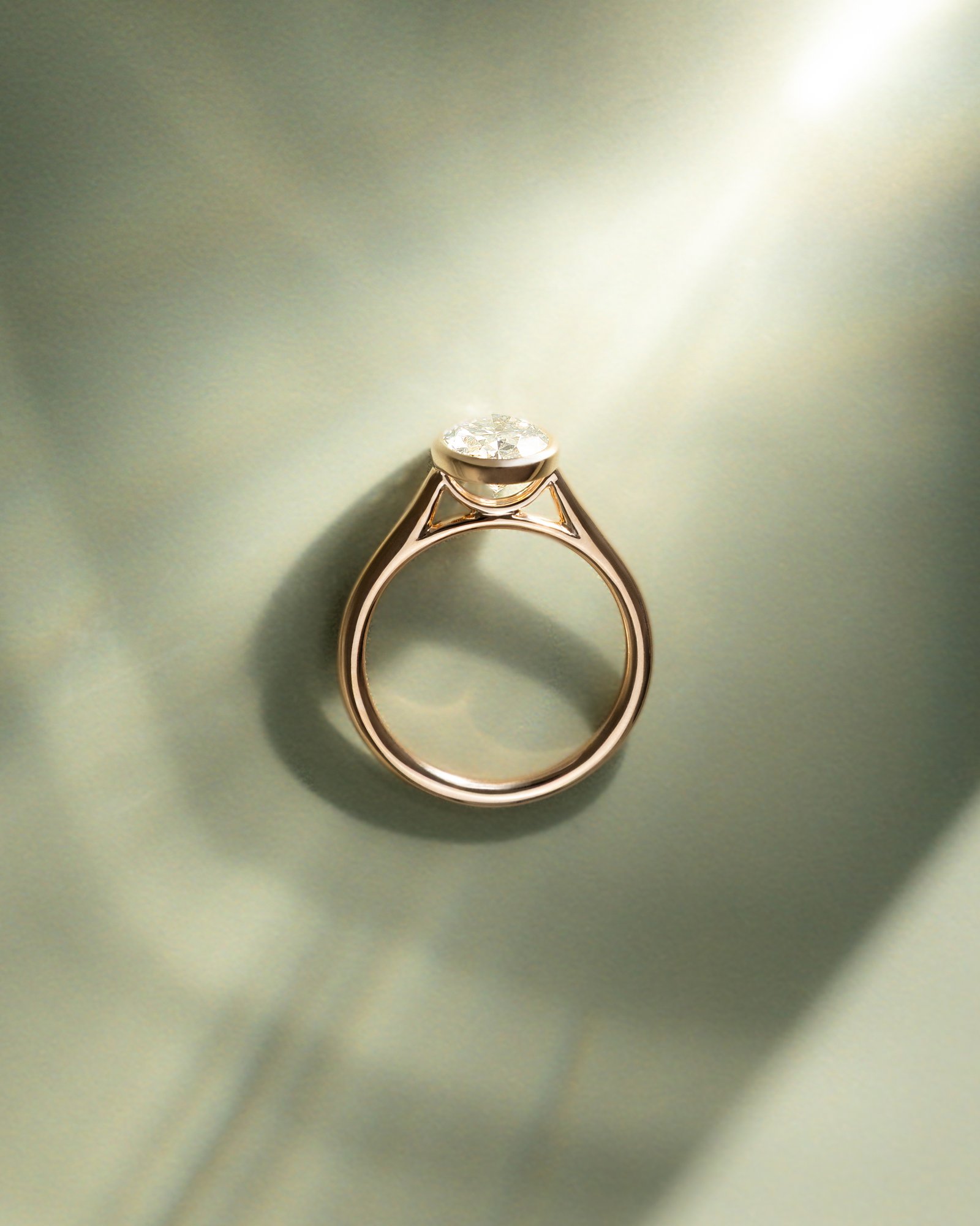 Daphne - Oval Solitaire with Cathedral Bezel Setting Lifestyle Image