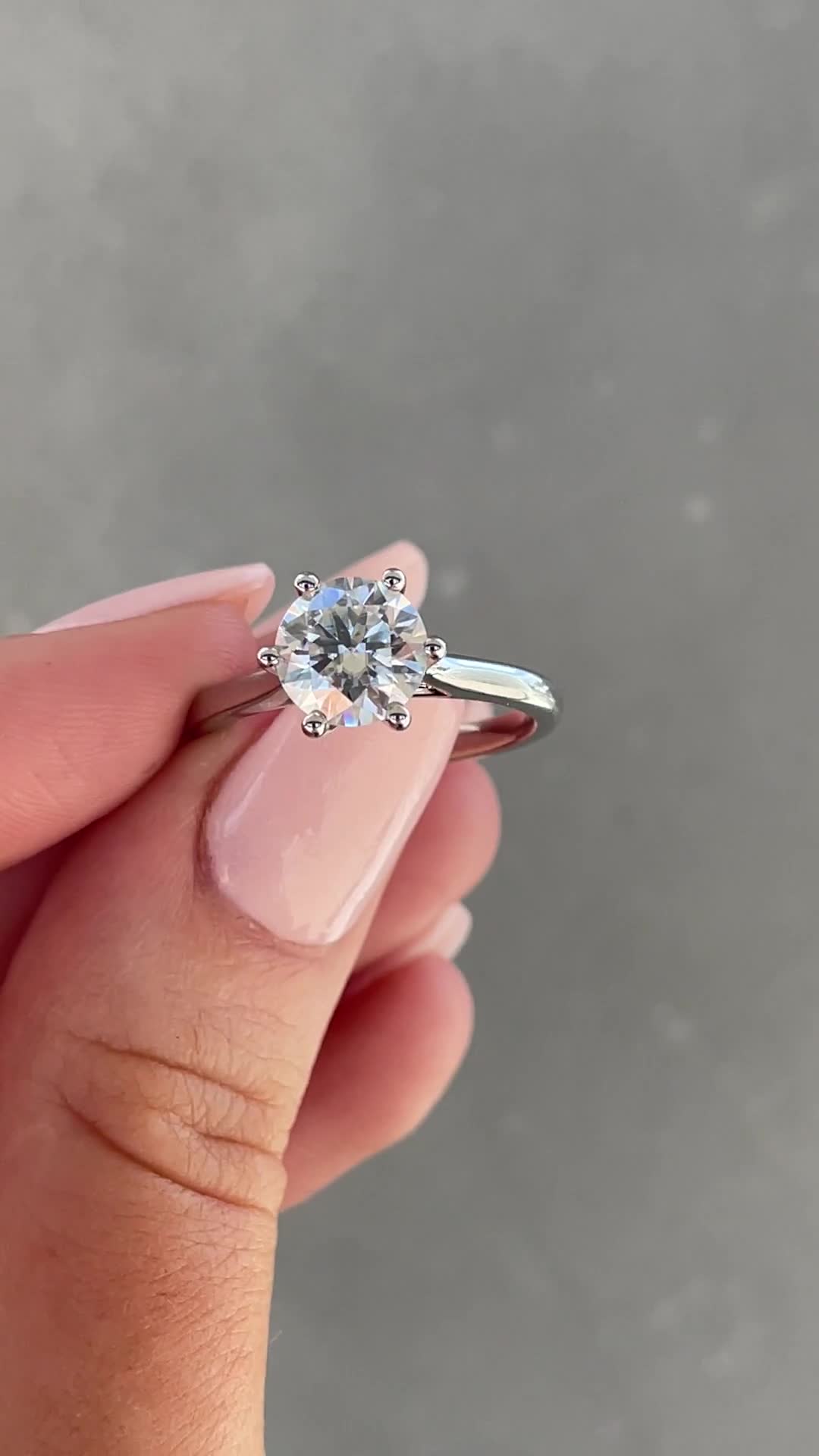 Delilah - 6 Claw Cathedral Round Solitaire Lifestyle Image