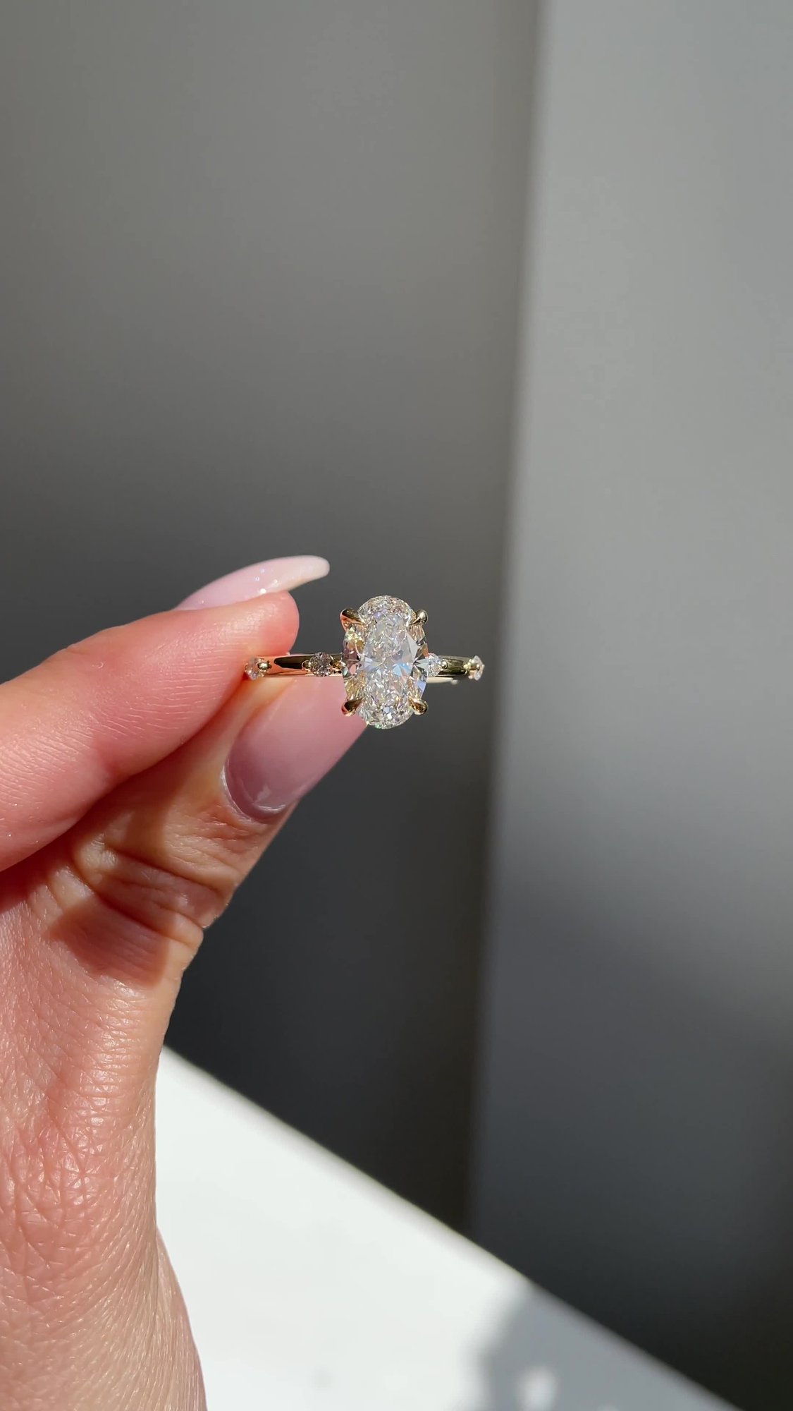 Elise  Oval Solitaire with Hidden Halo and Accent Stones Lifestyle Image