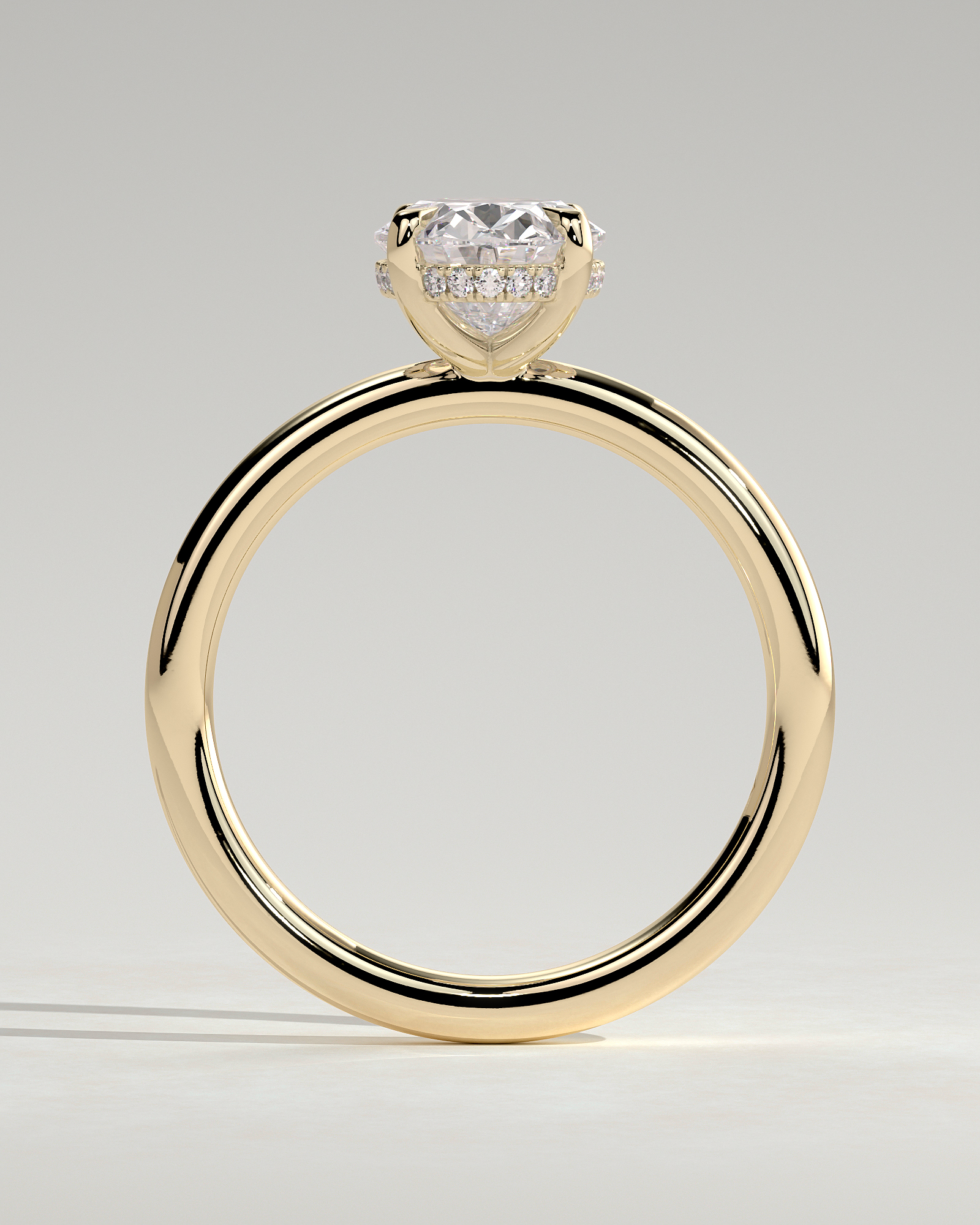 Emma  Oval Solitaire with Hidden Halo - 18k Yellow Gold High Setting