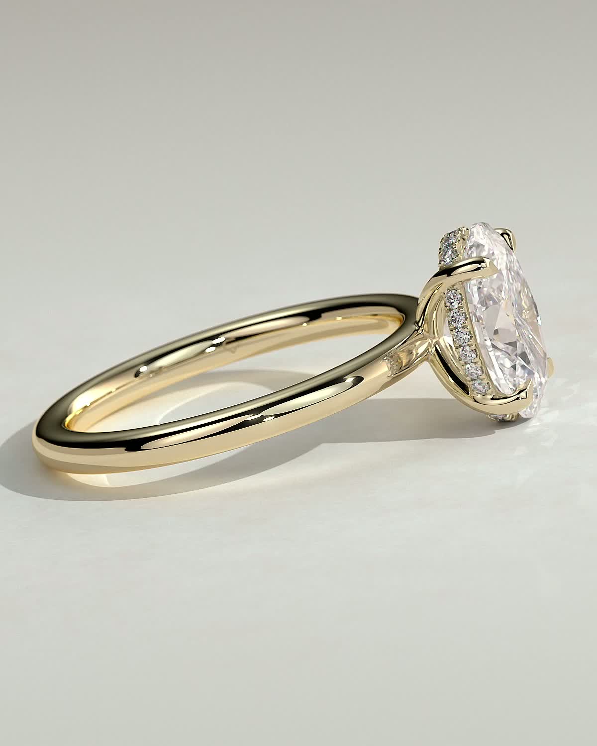 Emma  Oval Solitaire with Hidden Halo - 18k Yellow Gold High Setting