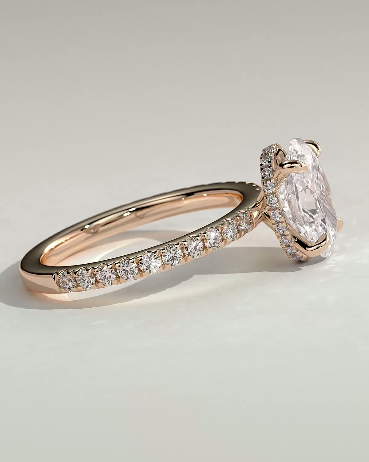 Oval 4 Claw Solitaire with Wrap Around Hidden Halo and Pave Band Engagement Ring - 18k Rose Gold