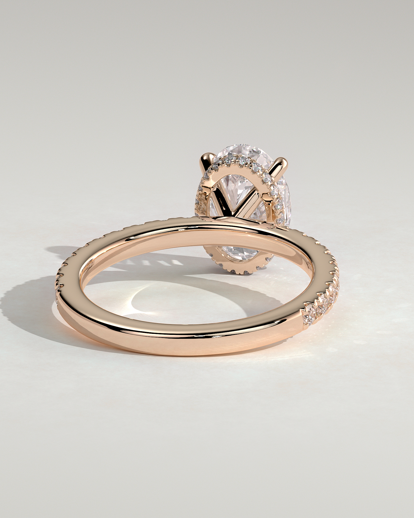 Oval 4 Claw Solitaire with Wrap Around Hidden Halo and Pave Band Engagement Ring - 18k Rose Gold