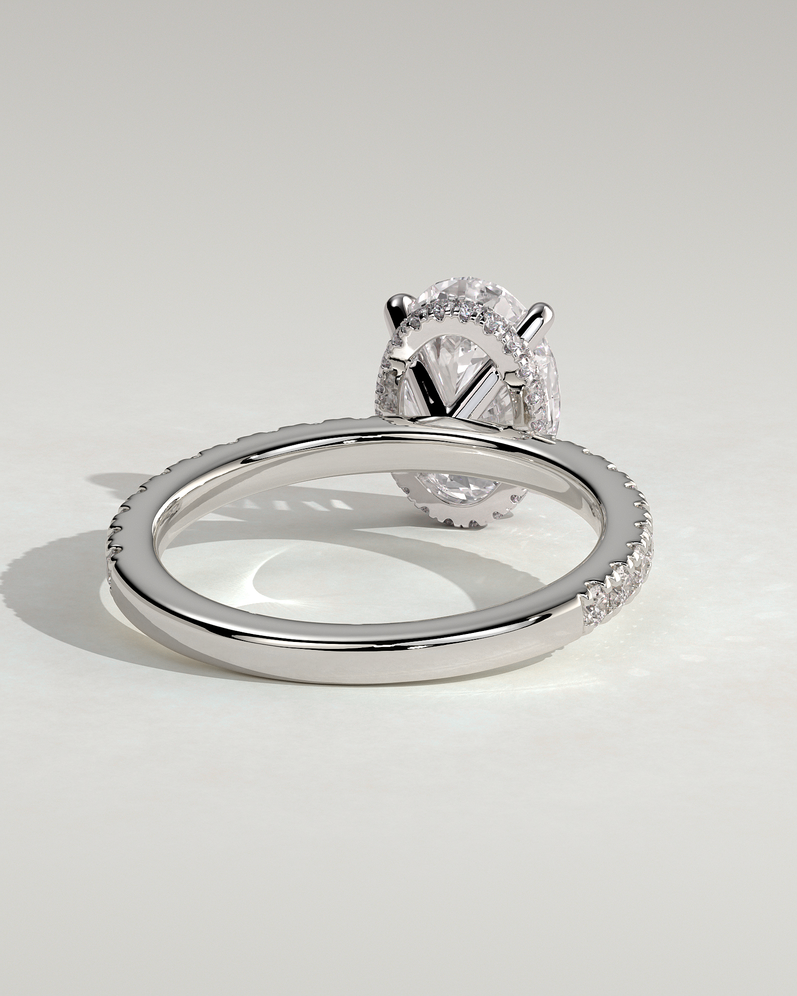 Oval 4 Claw Solitaire with Wrap Around Hidden Halo and Pave Band Engagement Ring - 18k White Gold