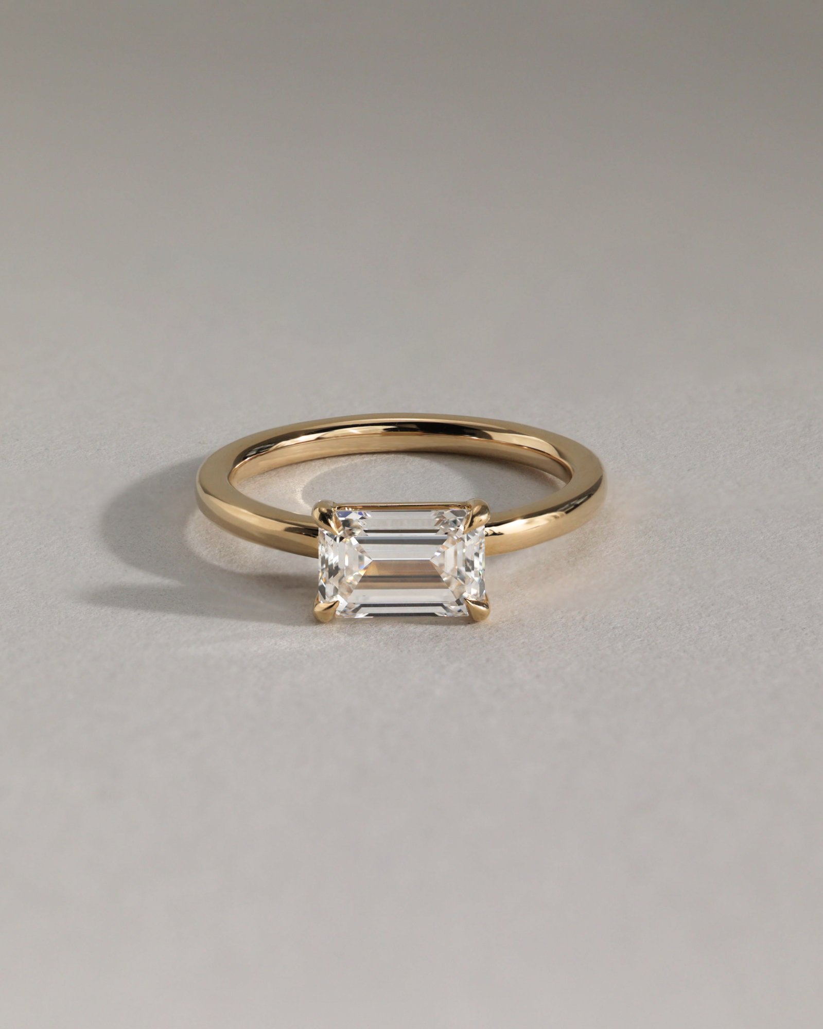 Evelyn  East West Emerald Solitaire Lifestyle Image