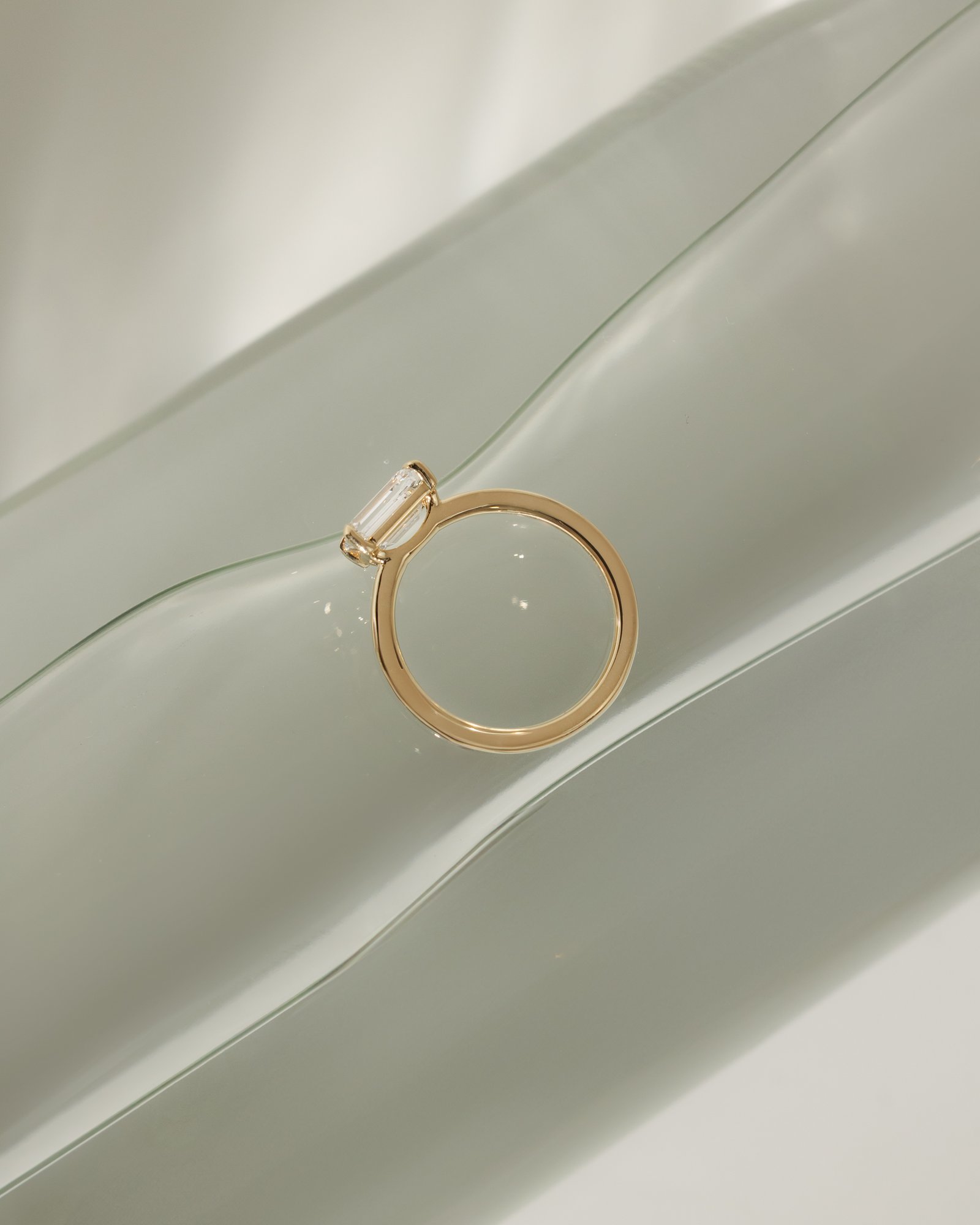 Evelyn  East West Emerald Solitaire Lifestyle Image