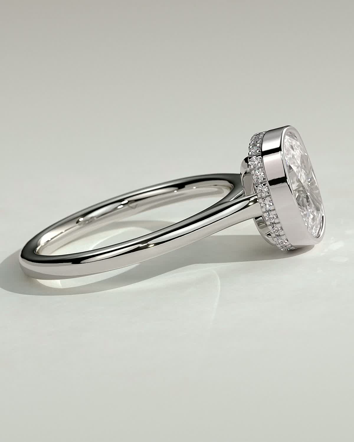 Elongated Cushion Bezel Solitaire with Hidden Halo and Cathedral Setting Engagement Ring - 18k White Gold