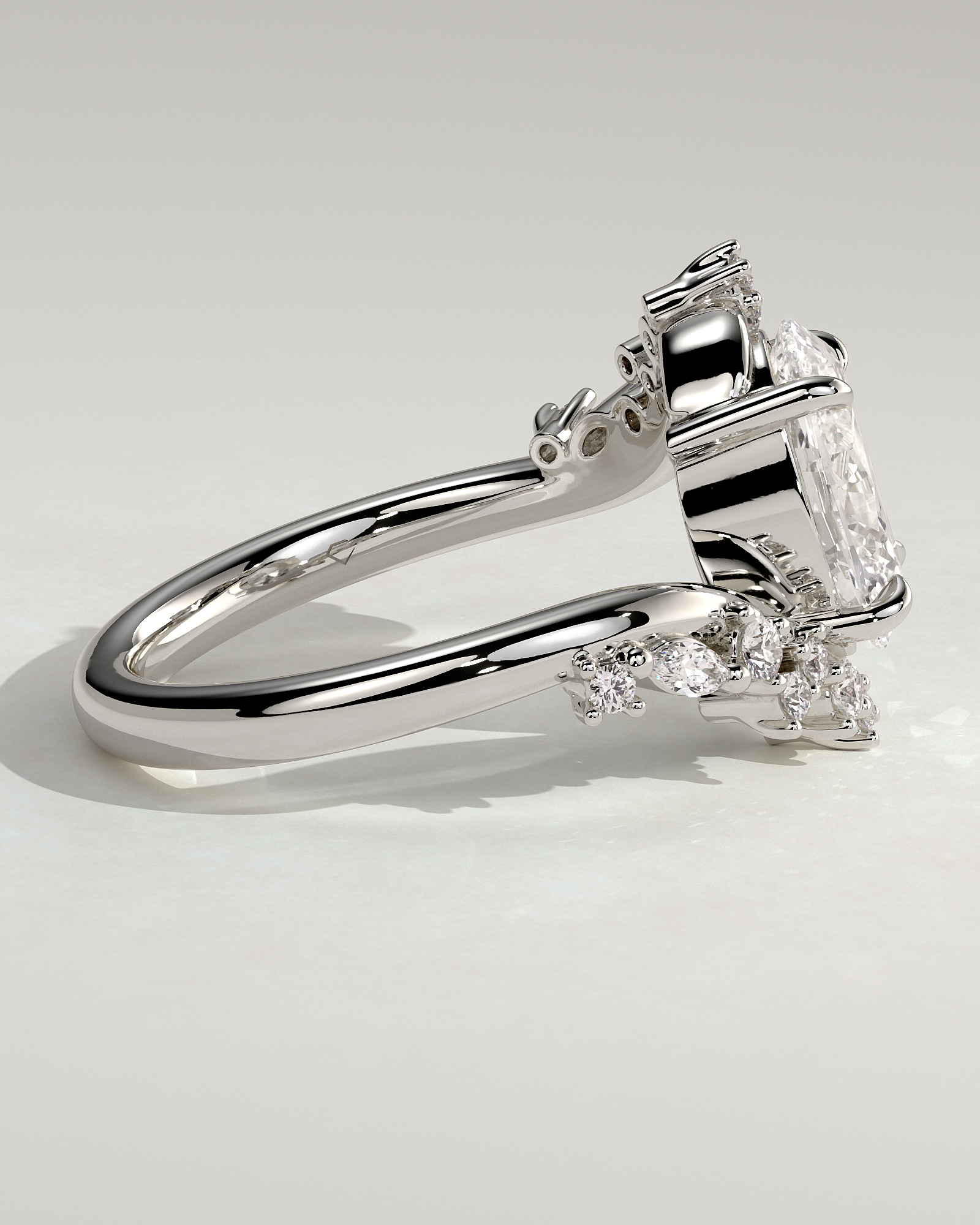 Ezmerelda - Oval Bypass Solitaire with Clustered Accent Stones - 18k White Gold