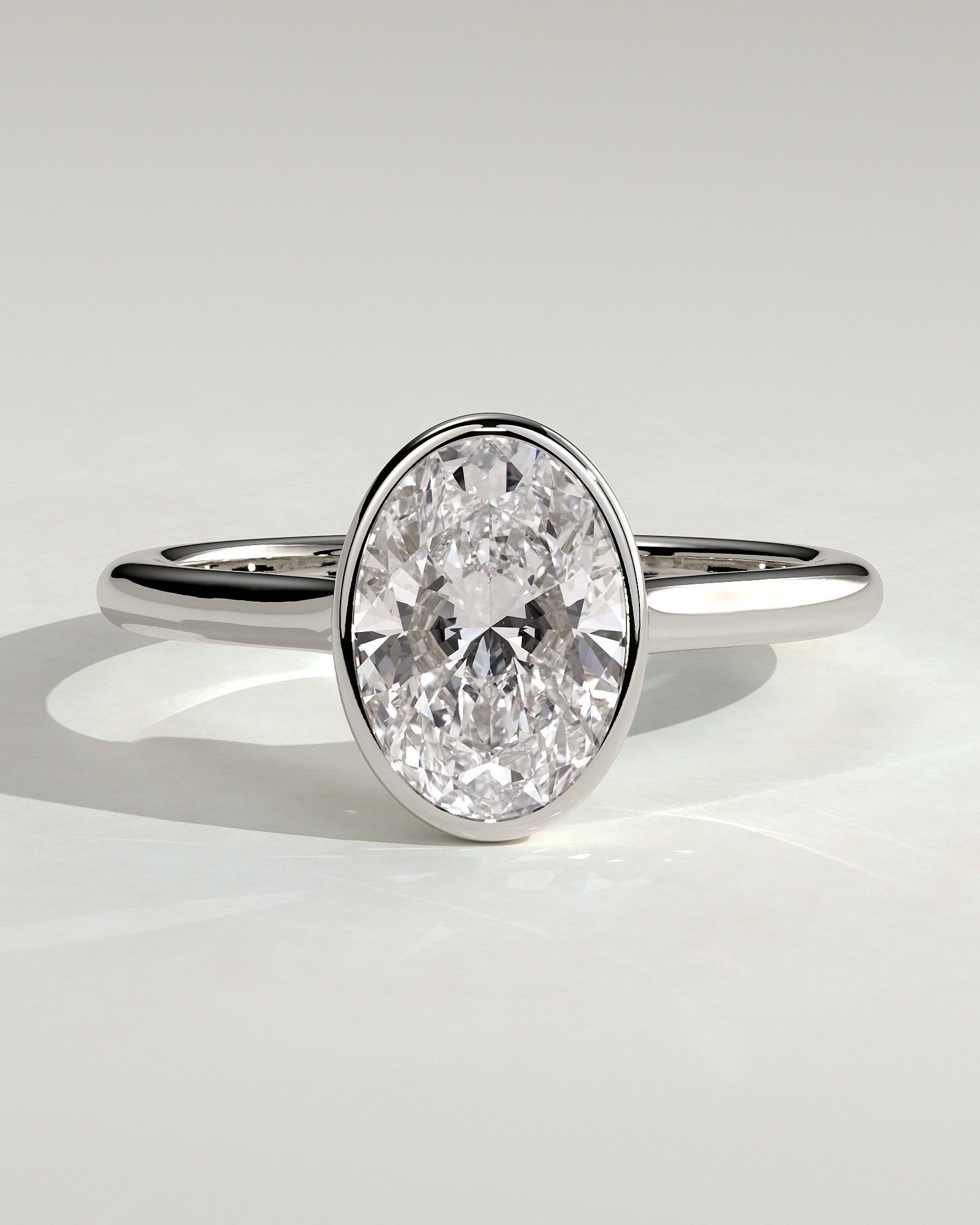 Gemma  Bezel Set Oval Solitaire - 18k White Gold