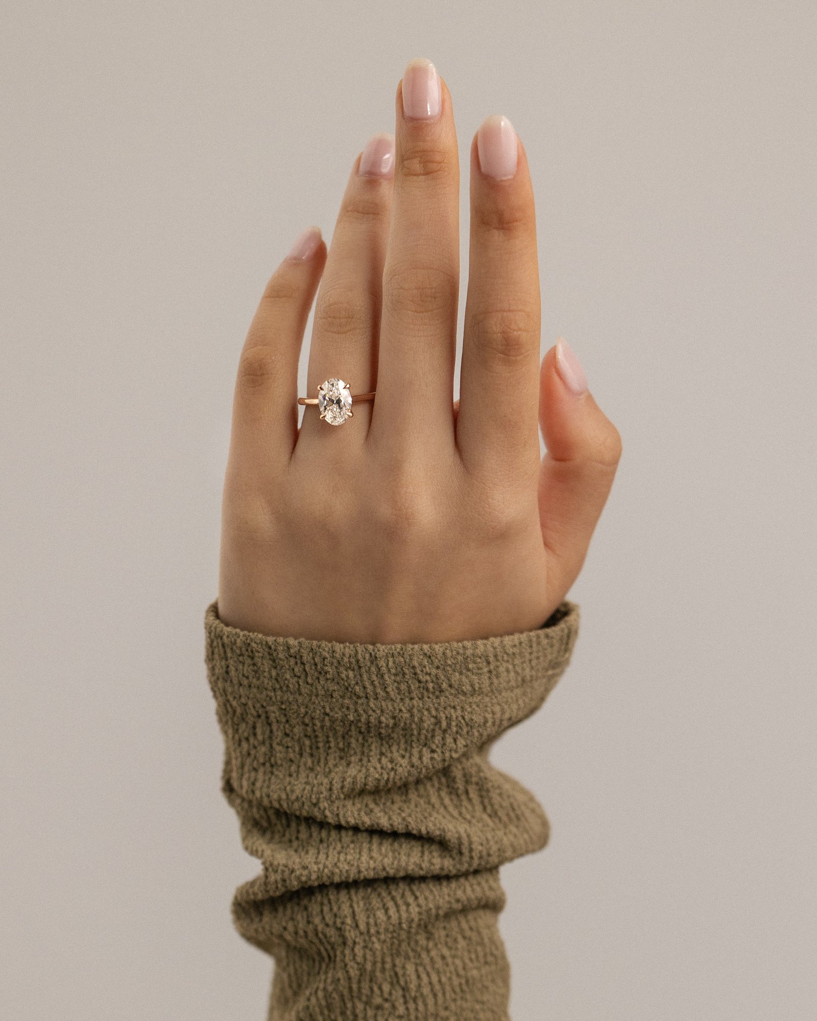 Hilary - 4 Claw Oval Solitaire Lifestyle Image