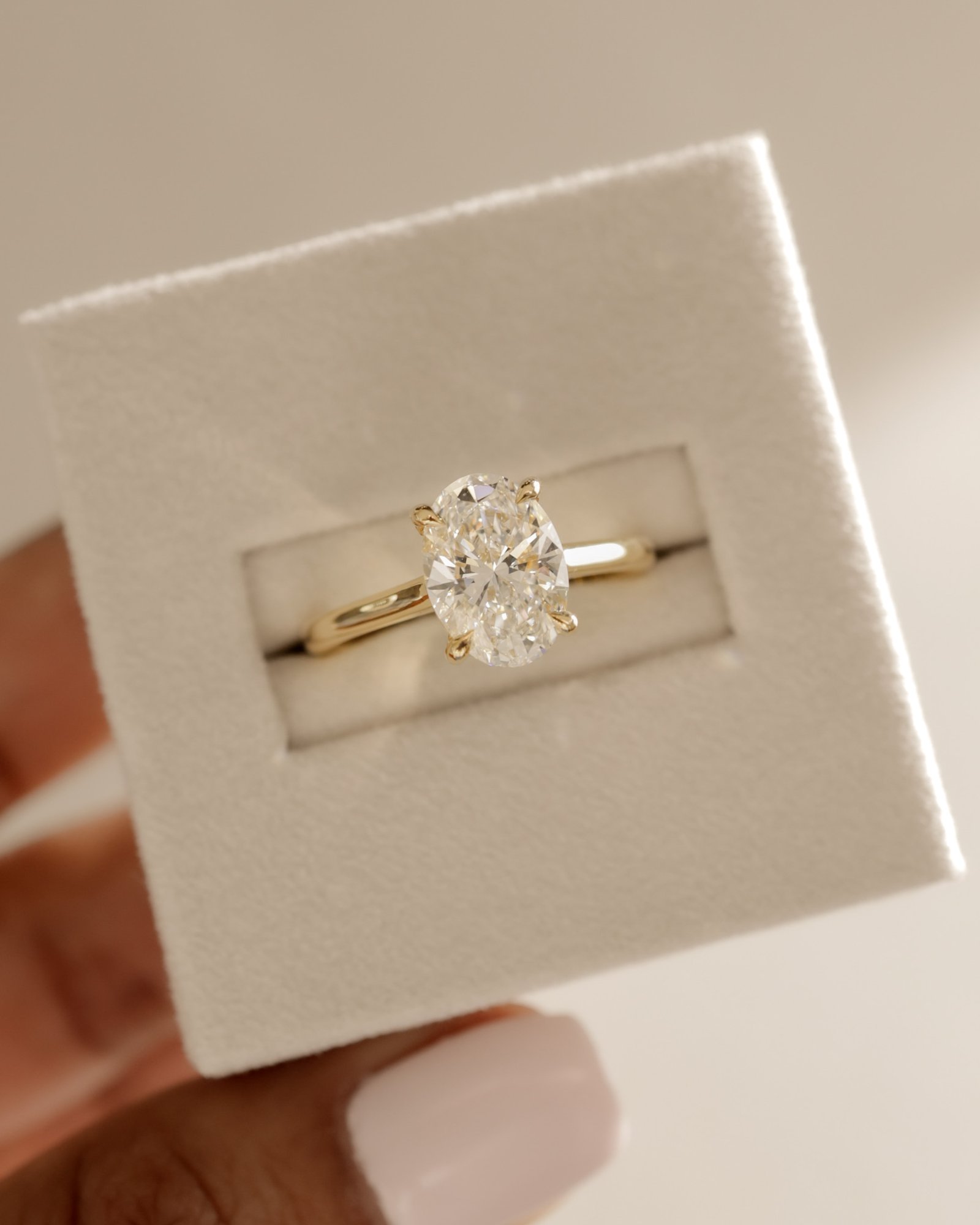 Hilary - 4 Claw Oval Solitaire Lifestyle Image