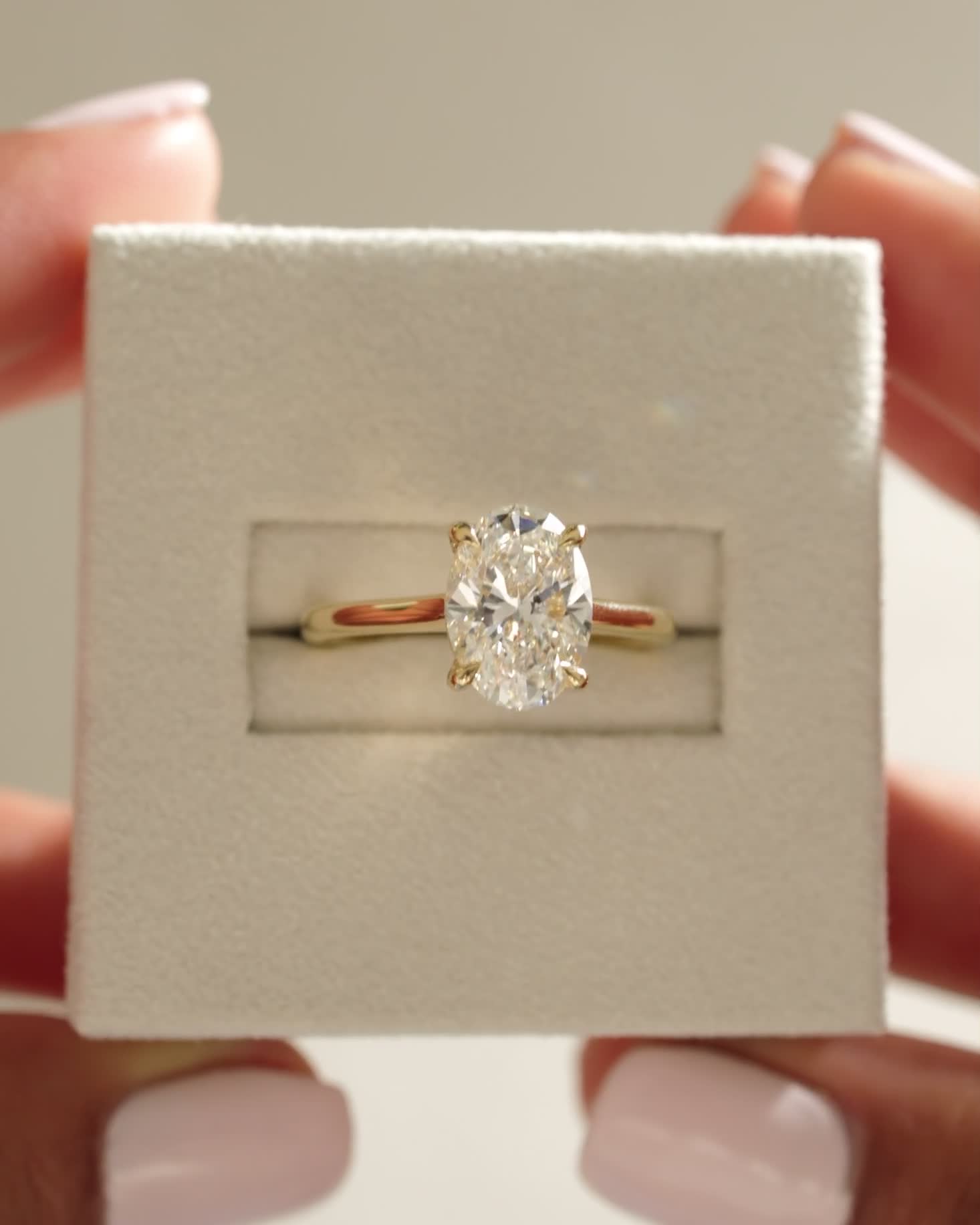 Hilary - 4 Claw Oval Solitaire Lifestyle Image