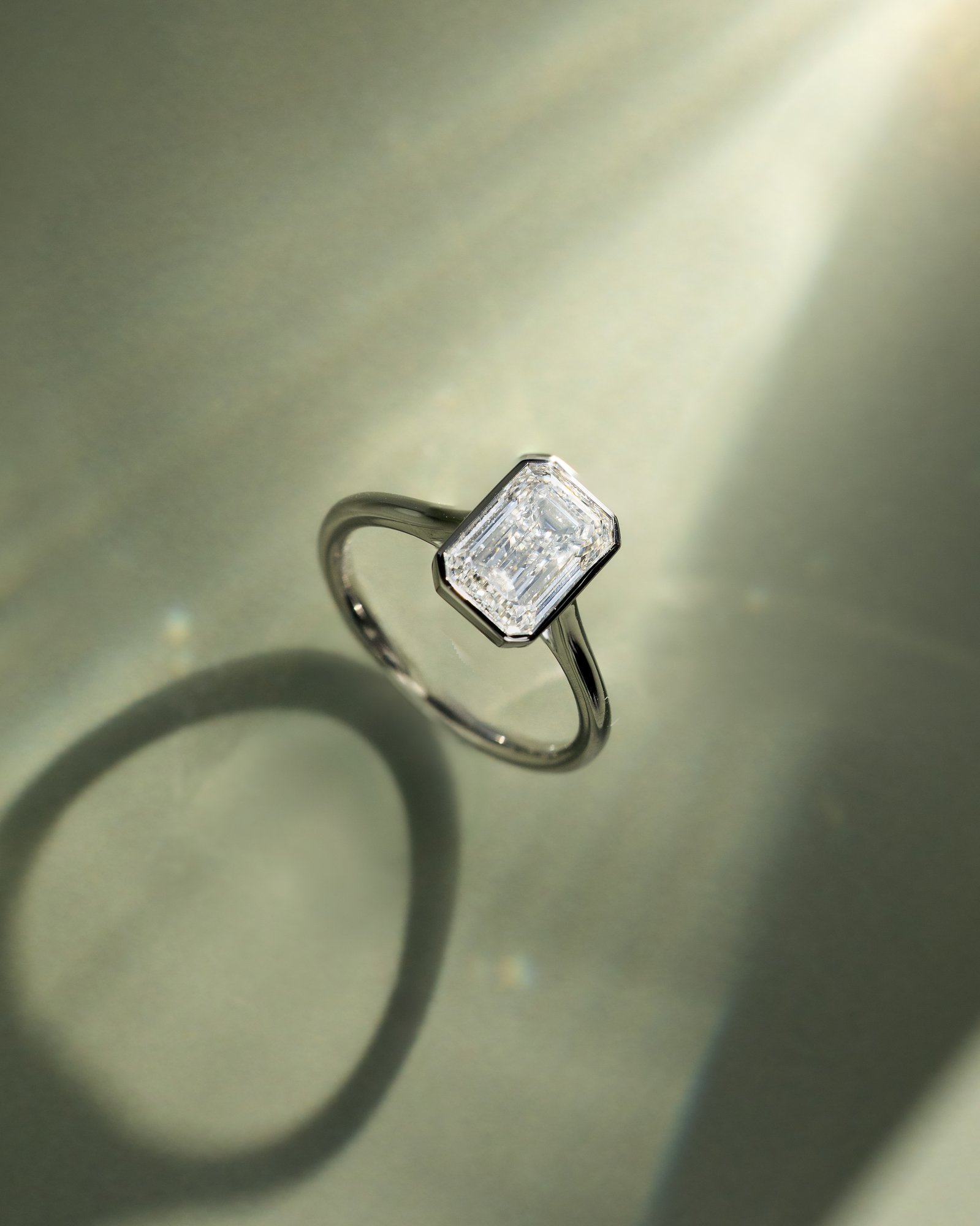 Imani - Bezel Set Emerald Solitaire Lifestyle Image