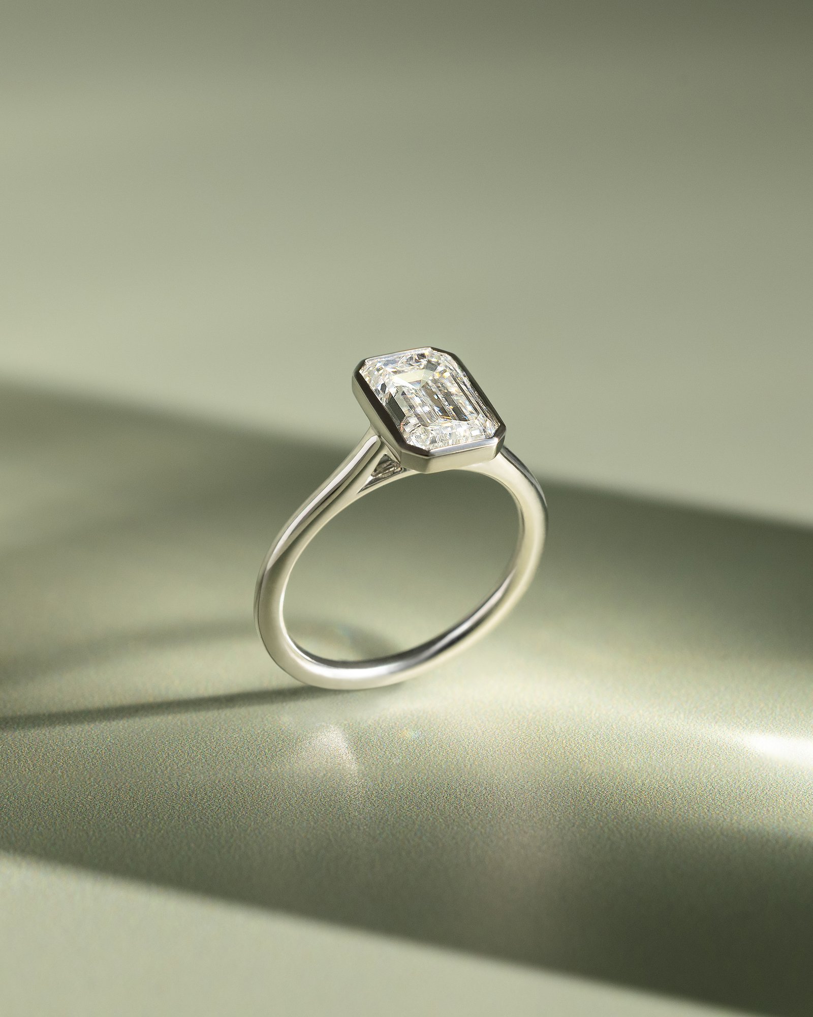 Imani - Bezel Set Emerald Solitaire Lifestyle Image